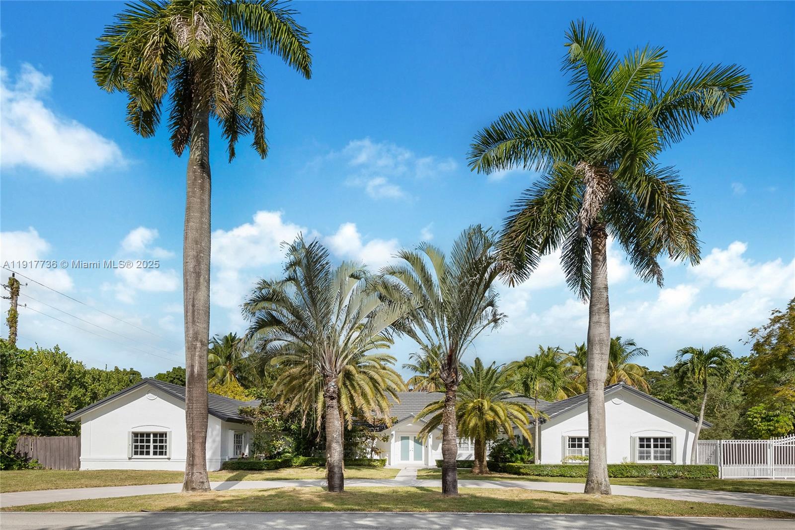 Experience the epitome of modern living in this stunningly remodeled one-story home located in the desirable Pinecrest neighborhood. Nestled on a generous corner lot spanning more than an acre. Step inside to find a spacious open floor plan that invites both relaxation and entertaining. The gourmet kitchen is a chef's dream, equipped with top-of-the-line appliances and ample counter space. Vaulted ceilings throughout the home enhance the sense of space and light, while stylish closets and beautifully designed bathrooms offer both functionality and flair. Large beautiful windows invite natural light, creating an inviting atmosphere and providing breathtaking views of your private oasis an expansive pool surrounded by a lush, meticulously landscaped garden lined with rare tropical trees.