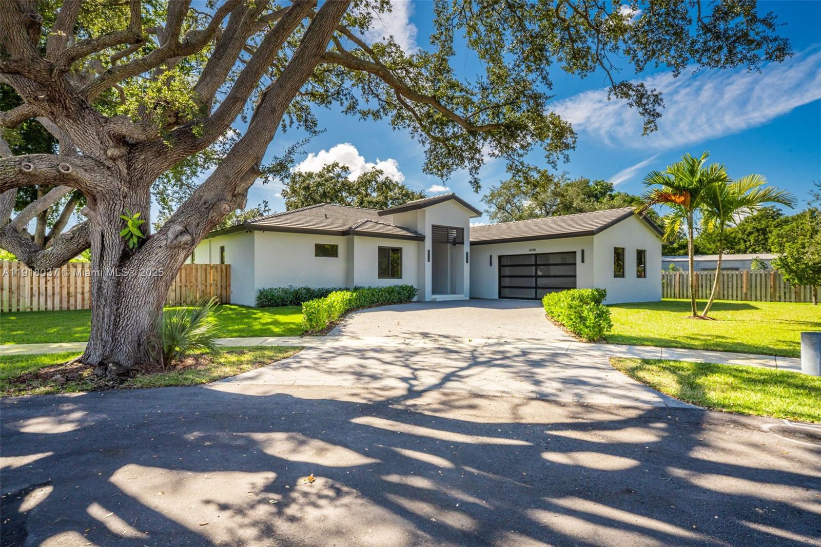 Welcome to Old Cutler Estates, where lifestyle comes first. Set on a private cul-de-sac wrapped in towering oak trees, 8240 SW 193rd Terrace offers an elevated outdoor experience with a spacious covered terrace, full summer kitchen, and a builder credit that can be used toward a new pool or an interest rate buy-down. The setting is serene, private, and rare — and the property is not located in a flood zone.The expansive lot provides exceptional versatility, offering ample room for a future pool, boat parking, RV storage, or additional outdoor living features without sacrificing green space. Inside, the home embraces a true open-concept layout, allowing the living, dining, and kitchen areas to flow seamlessly together. It’s the perfect setting for hosting gatherings, with large sliding doors connecting directly to the covered terrace for effortless indoor–outdoor entertaining.The home delivers sleek modern living with 48"×48" imported porcelain tiles, an open concept layout, and a designer kitchen featuring solid wood cabinetry and Bosch appliances. Impact windows and doors flood the space with natural light while enhancing security and efficiency. The epoxy-finished garage with modern glass-panel doors adds a polished, architectural touch. A 1-year builder warranty provides peace of mind.A perfect blend of modern luxury, privacy, and premium finishes — this is Old Cutler Estates living at its finest.