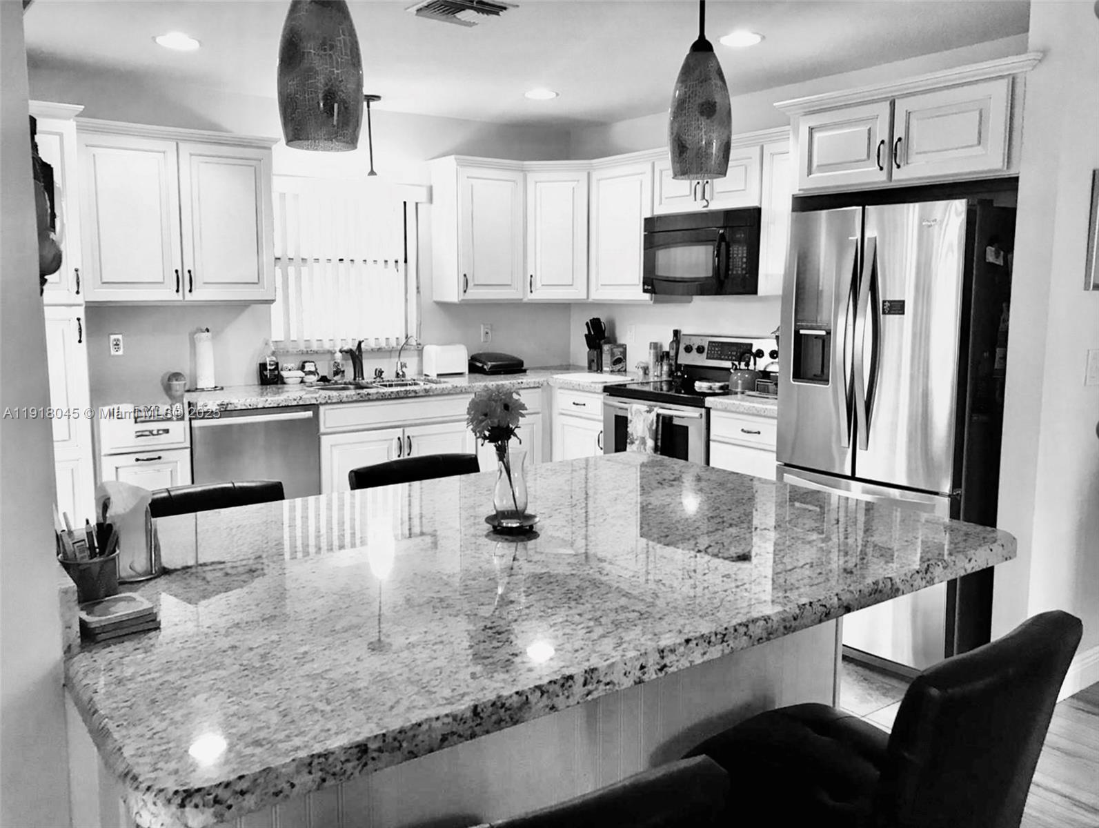 Welcome home! Renovated home with an open floorplan.  Spacious kitchen with granite counters and a large granite island, the perfect spot for meals. Wood floors. AC is less than a year old. Electric is updated. This home is just a hop, skip and jump from the keys. Or enjoy the neighborhood pool and clubhouse where there is always an activity. Take an evening walk through the peaceful gated community. HOA payment covers cable, internet, landscaping and house painting.