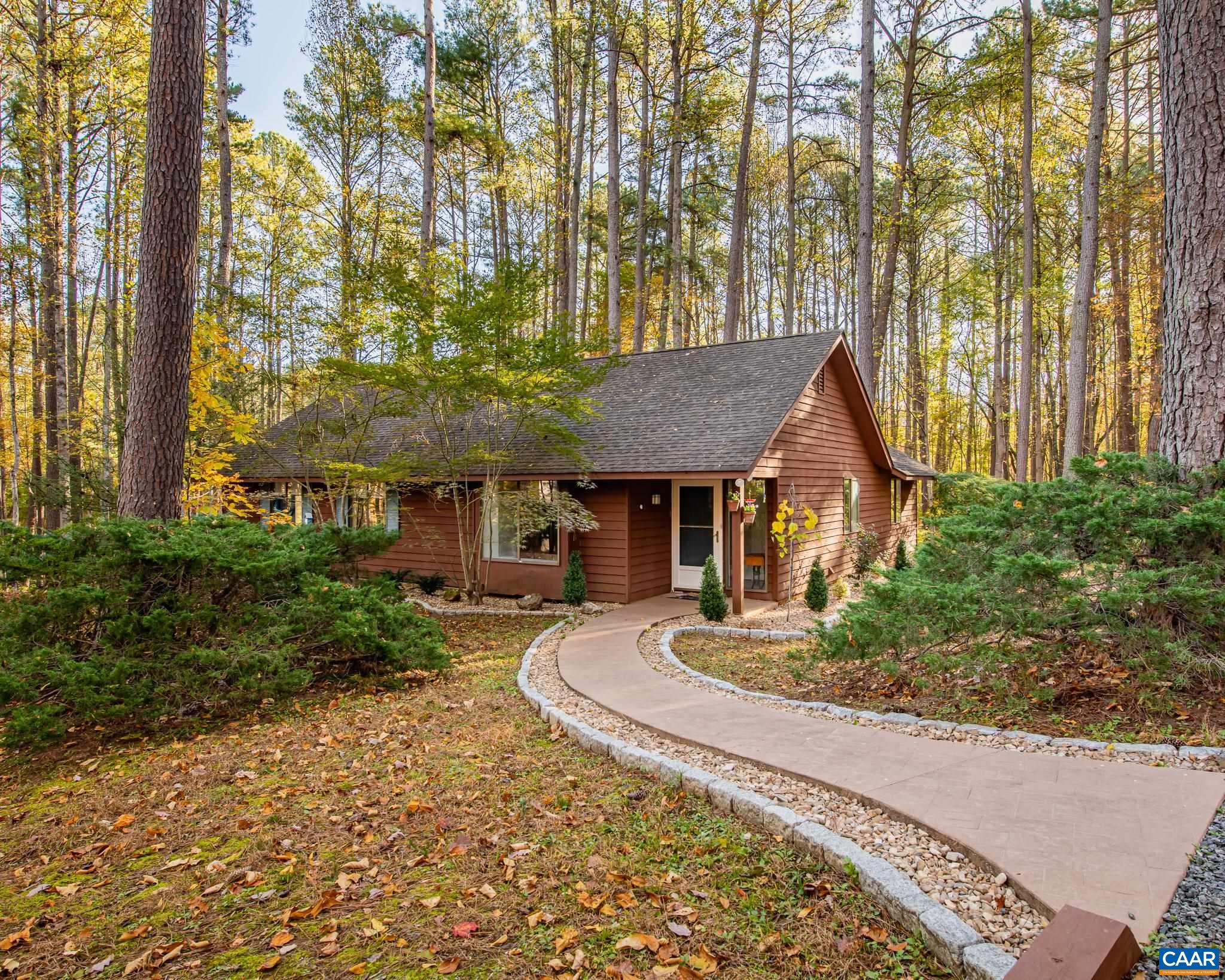 Discover serene One Level Living on this beautifully private, Wildlife-Certified Habitat in the coveted Earlysville Forest Community. Nestled on a meticulously maintained Pond View Lot; this 3 Bedroom & 2 Full Bathroom home offers the perfect blend of comfort, nature & convenience. The open flow of this layout features a welcoming covered front porch, eat in kitchen, spacious sun drenched living room w/ cozy wood-burning fireplace, & formal dining area. The Owner's focus has been on ensuring the home is ready for the new owners! Already completed Extensive professional Tree Work, Exterior maintenance, Safety & Function of the Home's Systems. Whether you're enjoying quiet mornings on the property or appreciating the ideal location-close to everyday amenities, this home delivers a rare combination of privacy, beauty & practicality. A truly special place- inside & out.