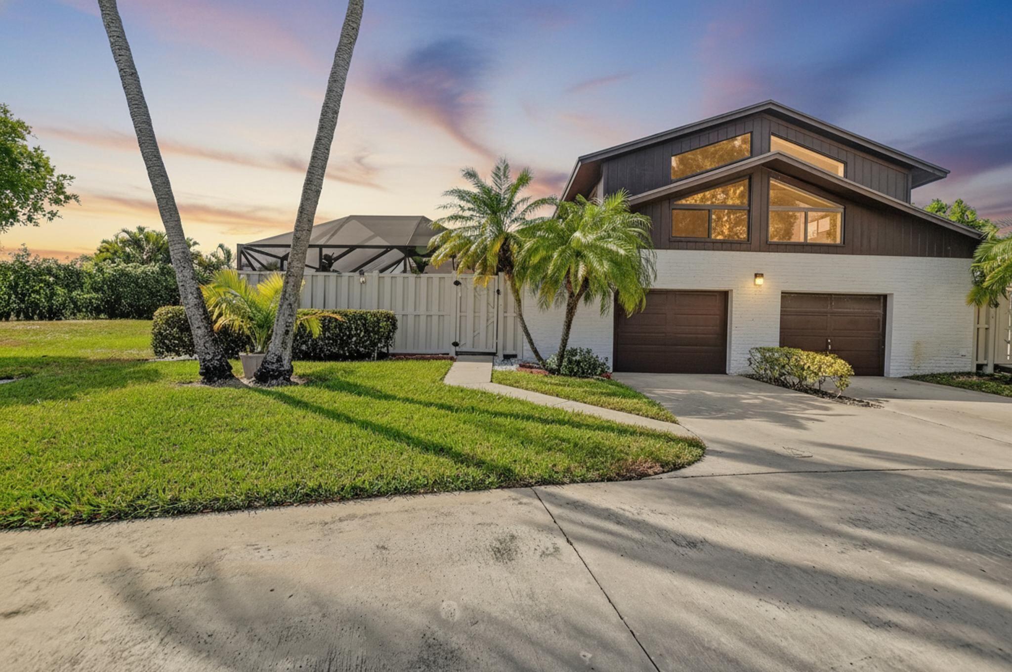 Gorgeous townhouse with private pool in Boca Gardens - Move in ready! Beautifully upgraded; with an abundance of natural light, 2025 upgrades and your own heated pool, this home offers the perfect blend of privacy, luxury and convenience! Full 3 beds, 3.5 baths, 1 full car garage, private driveway, 2 additional guest parking spaces plus a safe play area for children and/or pets. Fully redesigned kitchen with stone island, custom cabinets, circular rotating shelf, spacious pantry and pull-out drawers. Top of the line 2025 Samsung Wi-Fi controlled appliances,  including a wine and beverage cellar, washer, and dryer. Advanced 2025 HVAC system that can be controlled manually or remotely via Google Nest, for optimal comfort. High ceilings, skylights and 1,325 living square feet under air. The pool area boasts recently refinished pavers and automatic solar pool backyard lighting. A 2025 Wi-Fi-controlled awning with LED lighting, wind sensor, and remote offers shade and ambiance, complemented by a stylish impact-resistant door for added security.Roof was replaced in 2021, and the HOA covers roof repairs, fencing maintenance, enhanced cable TV, and amenities such as three pools, a gym, tennis and pickleball courts, kids playground, sports courts, scenic lakeside sidewalks, and school-bus transportation to top-rated nearby schools.Boca Gardens is pet friendly and conveniently located near shopping, dining, and major highways. Call today to book your private tour before its gone!