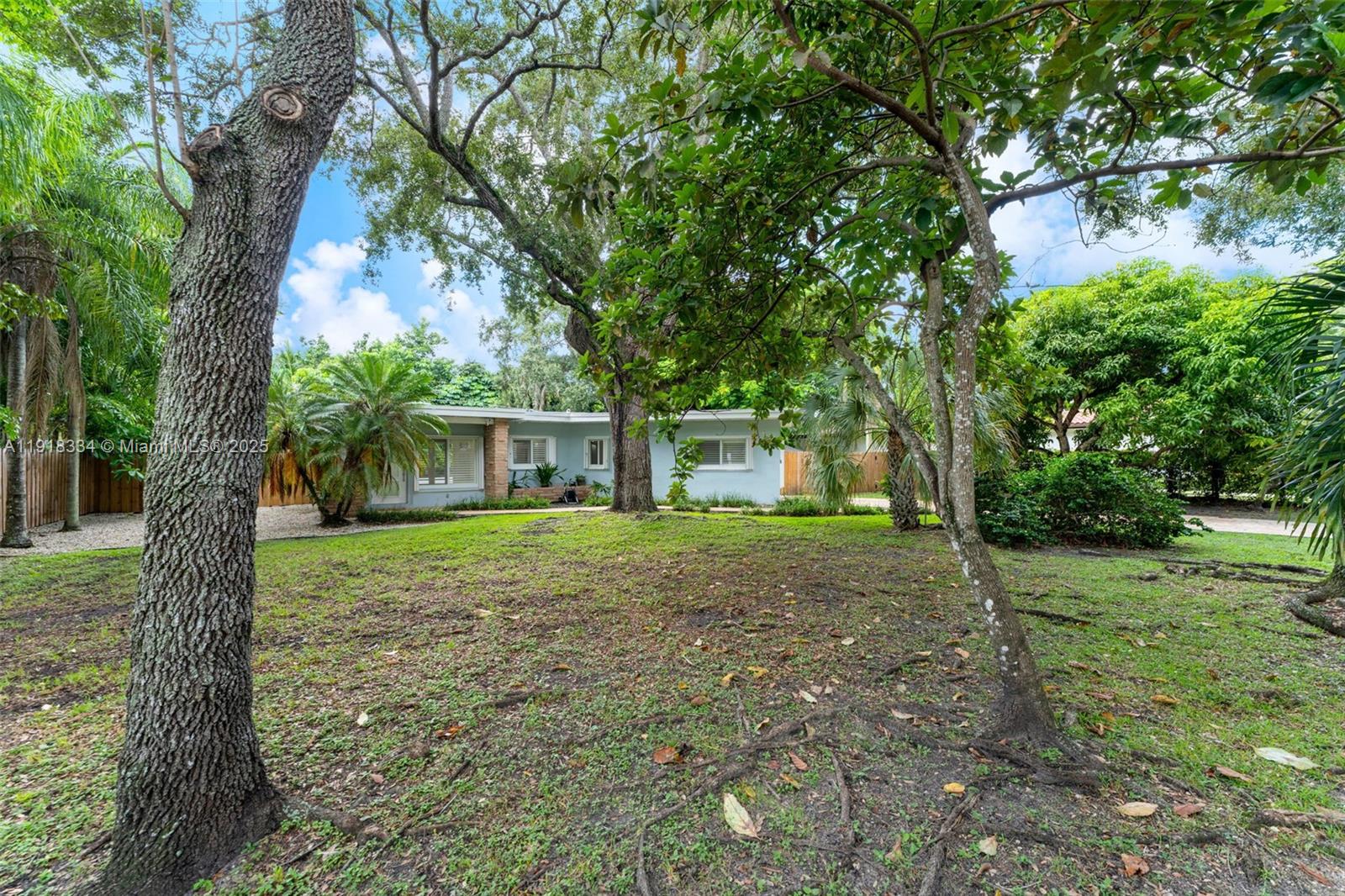Charming 3-bedroom, 2-bath pool home in prime Pinecrest, offering 1,312 sq ft of living space on a spacious 14,400 sq ft lot. This home gives you those classic Old Florida vibes with bright interiors, terrazzo floors, wood-beamed ceilings, and an updated kitchen featuring white cabinetry, granite counters, and stainless steel appliances. French doors open to a large backyard with a salt-chlorinated pool, covered patio, and lush landscaping—perfect for entertaining or relaxing.Located near Suniland Park, shops, and with easy access to US-1. Top-rated school zones. Great as-is, ready for a remodel, or an excellent opportunity to build your dream home. Easy to show!
