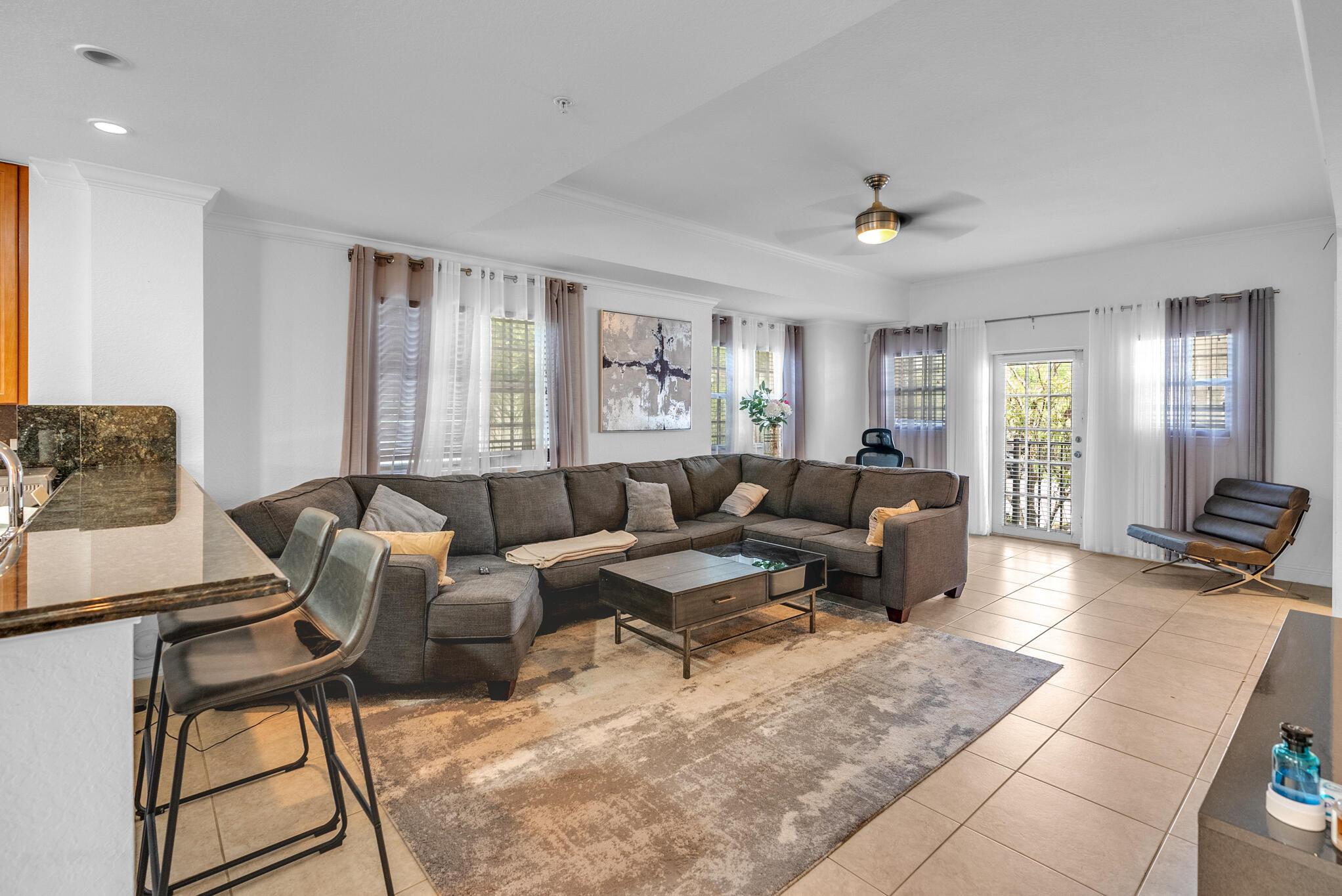 Investor's Dream: Move-In-Ready Townhouse in Developing Pompano Beach! LOW HOA!!!Located in the highly sought-after Grove community of Pompano Beach, this stylish and spacious 3-bedroom, 4-bathroom corner townhouse is perfect for young families or investors seeking a low-maintenance property with great rental potential. Key Features: Private Guest/In-Law Suite: The first floor offers a separate, private unit ideal for guests or in-laws. countertops, stainless steel appliances, and ample storage space. Seamless Indoor-Outdoor Flow: Enjoy expansive balconies on both the second and third floors, perfect for relaxing or entertaining. Modern Amenities: BRAND NEW water heater, In-unit laundry, smart home features including Nest thermostat, digital locks, and carafe openers.Abundant Parking: Includes an attached 1-car garage and driveway.Quiet Corner Location: Offers privacy with the added benefit of being tucked away in a peaceful corner of the community.Resort-Style Community Amenities:Pool, fitness center, and clubhouse provide a lifestyle of ease and leisure for all residents.Ideal Location:Quick access to I-95, Florida's Turnpike, shopping, dining, and the beach just a 5-minute ride away!Perfect for:Move-up families looking for space and convenienceInvestors seeking a well-maintained, turnkey property with great rental potentialMaintenance-free, lock-and-leave lifestyle seekersAdditional Highlights:Recently replaced A/C, washer/dryer, and all furniture is included in the sale.Seller is motivated to sell quickly, so act fast!Don't miss out on this prime investment opportunity in a rapidly developing area!Seller is motivated to sell quickly, and is willing to leave all Furniture As Is