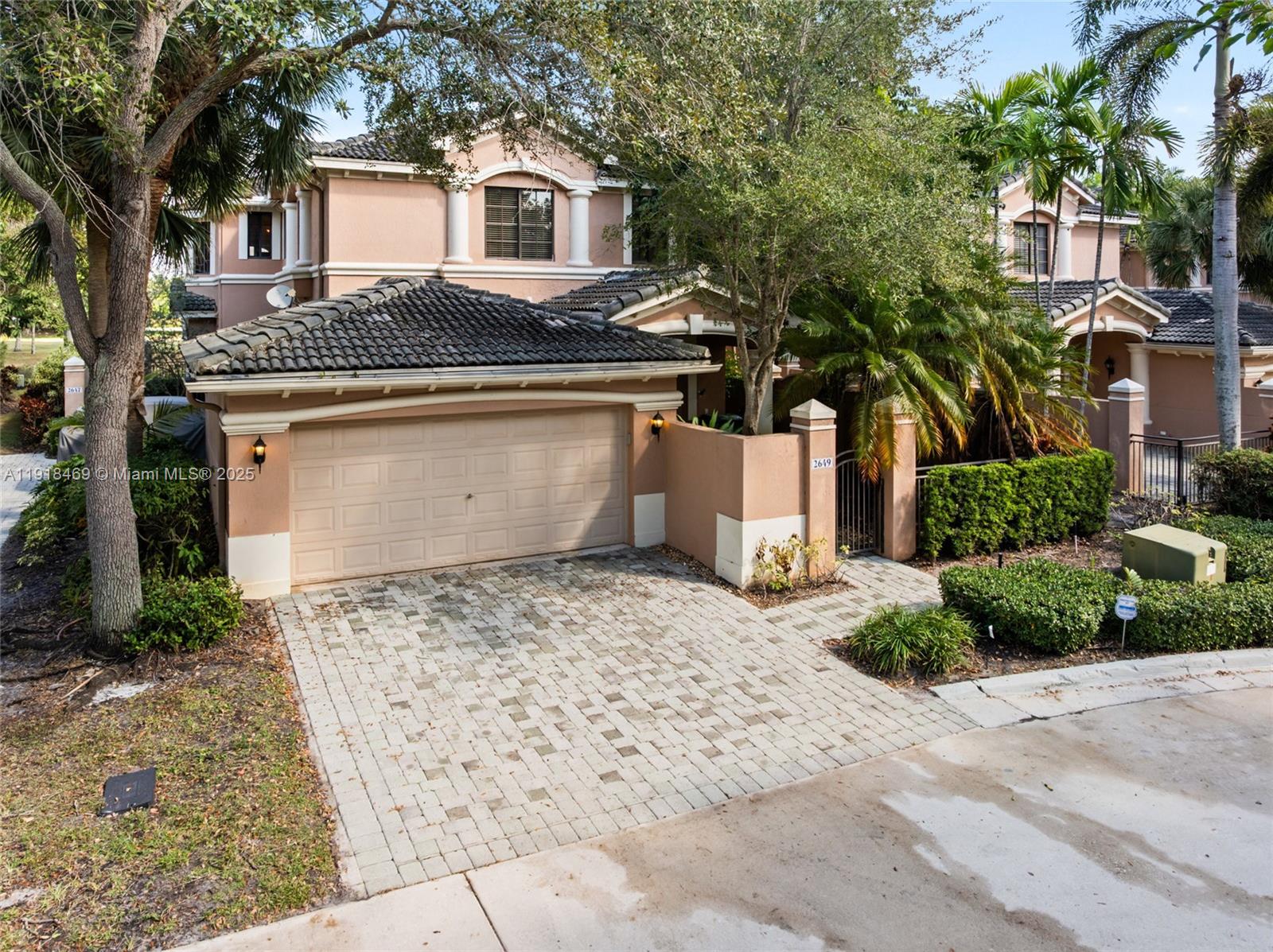 Golf-course views in the prestigious Courtside at Weston Hills! This spacious 3-bedroom, 2.5-bath home offers 2,290 sq ft of beautifully maintained living space with fresh interior paint, new luxury vinyl flooring in all bedrooms, and an open, light-filled layout. Enjoy a large great room, formal dining area, generous primary suite, and a screened-in patio overlooking the 5th fairway—perfect for morning coffee or evening sunsets.Designed for low-maintenance luxury living, this home includes a private 2-car garage, in-unit laundry room, walk-in closets, and a split floor plan ideal for privacy. Also, this home features a spacious storage room which could be repurposed as an in-home elevator.  Zoned for A-rated Weston schools and minutes to dining, parks, and I-75.Vacant and easy to show.