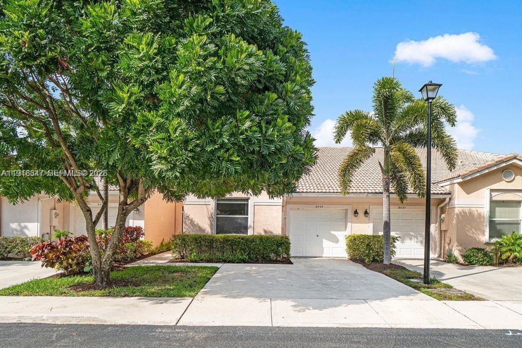 Stunning waterfront exterior at 2437 Coral Trace Cir - Townhouse in Delray Beach