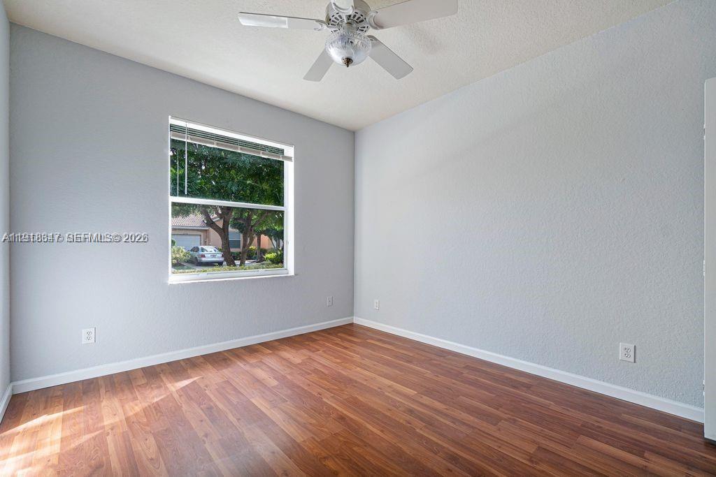 Spacious living room with panoramic views at 2437 Coral Trace Cir - Townhouse in Delray Beach