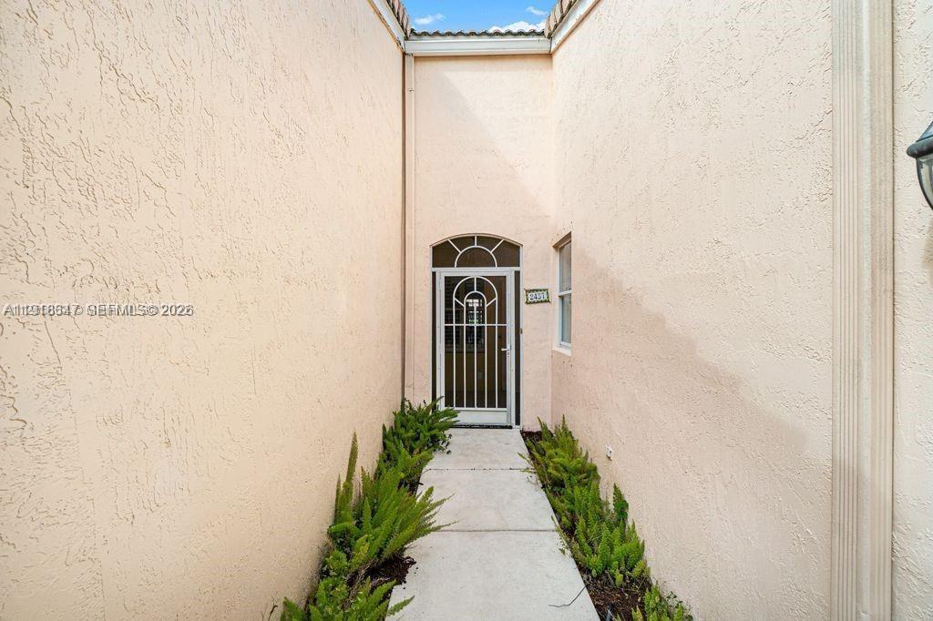 Modern kitchen with designer features at 2437 Coral Trace Cir - Townhouse in Delray Beach