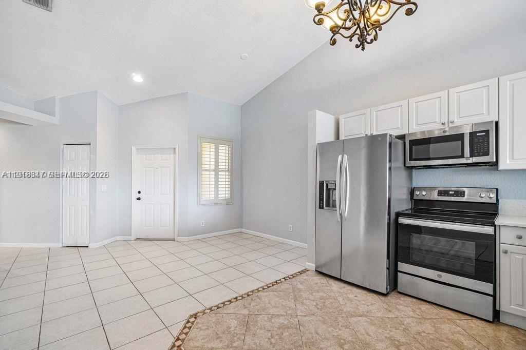 Well-appointed guest bedroom at 2437 Coral Trace Cir - Townhouse in Delray Beach