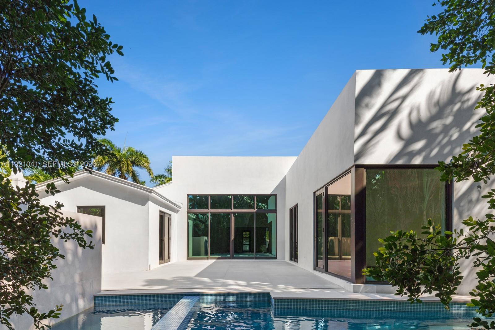 Welcome to this newly rebuilt & expanded contemporary residence in the exclusive, guard-gated community of Sunset Island IV. Enjoy unmatched privacy while being just moments from the shops, fitness studios & restaurants of Sunset Harbour.Taken down to the studs & thoughtfully redesigned, this oasis offers 4 beds, 4 baths, bright open living areas & a spacious garage. Every detail reflects refined craftsmanship & luxurious finishes w/ Febal & Edoné cabinetry for kitchen, bathrooms & closets, Lualdi Italian doors, wide-plank European oak floors, Gessi fixtures, DMF lighting & Lutron controls. Unwind w/ a plunge in the shimmering pool & dine alfresco on the serene patio. With construction nearing completion, a rare opportunity remains to collaborate w/your designer & make this home your own.