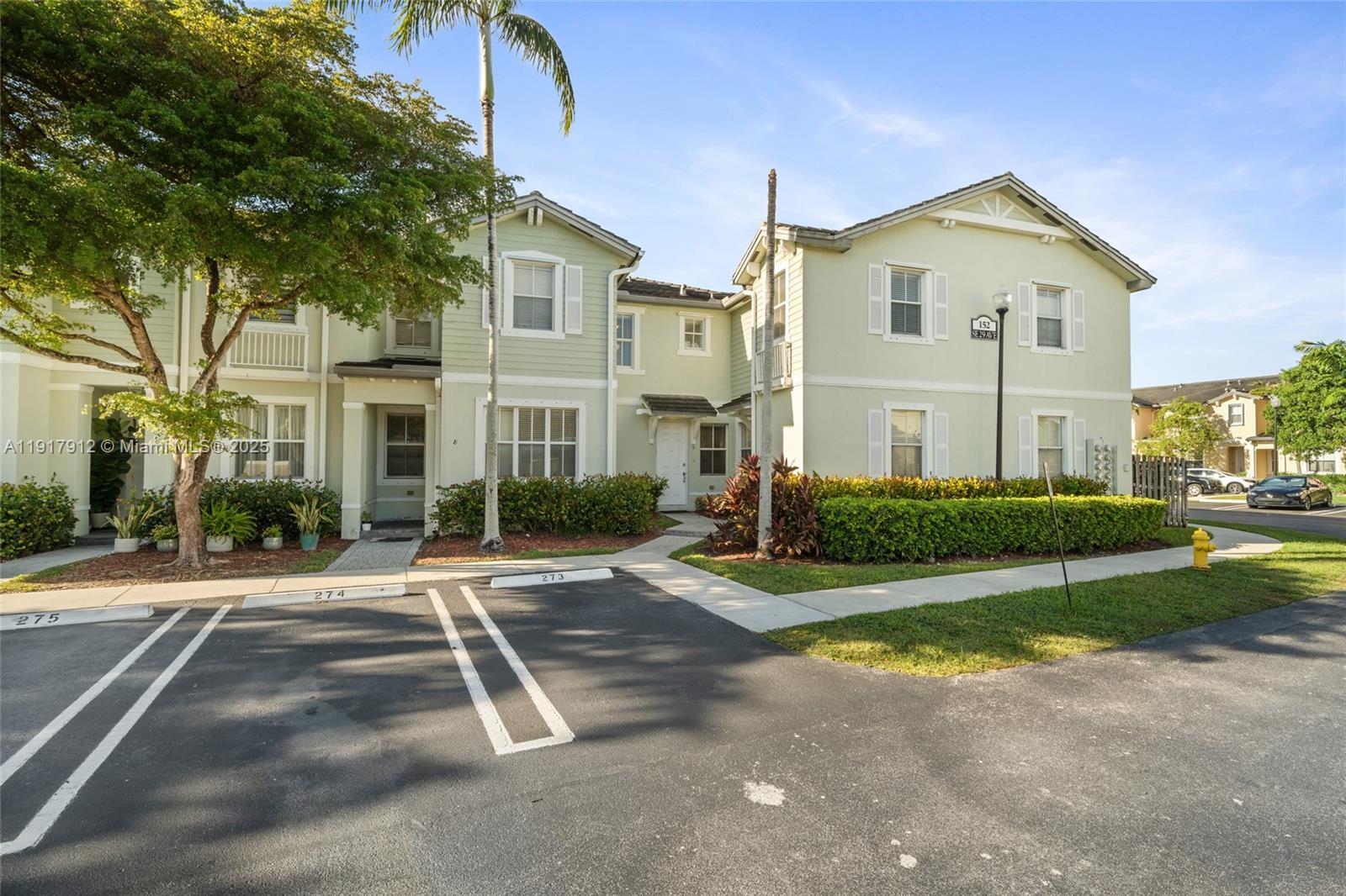 Bright and move-in-ready two-story townhouse in a secure gated community, offering a warm and inviting layout ideal for comfortable everyday living. The spacious first floor features tile flooring throughout, a bright living room with large windows, and an open dining area that flows seamlessly into the kitchen. The kitchen includes white cabinets, ample counter space, pantry storage, and direct views of the fenced backyard through sliding glass doors—perfect for gatherings and indoor-outdoor living. Upstairs, the wood-like laminate flooring creates a cozy atmosphere, and all three bedrooms offer generous space, natural light, and neutral tones to accommodate any style. The home also includes an in-unit washer/dryer and additional storage closets for convenience. Residents enjoy resort-style amenities such as a sparkling pool, playground, and walking trails. Ideally located near Baptist Health Homestead Hospital, Homestead Air Reserve Base, shopping, dining, top-rated schools, the Turnpike, and the Florida Keys. Surrounded by growing development and major employers, this community offers strong long-term value. A great opportunity for families, investors, or first-time buyers.