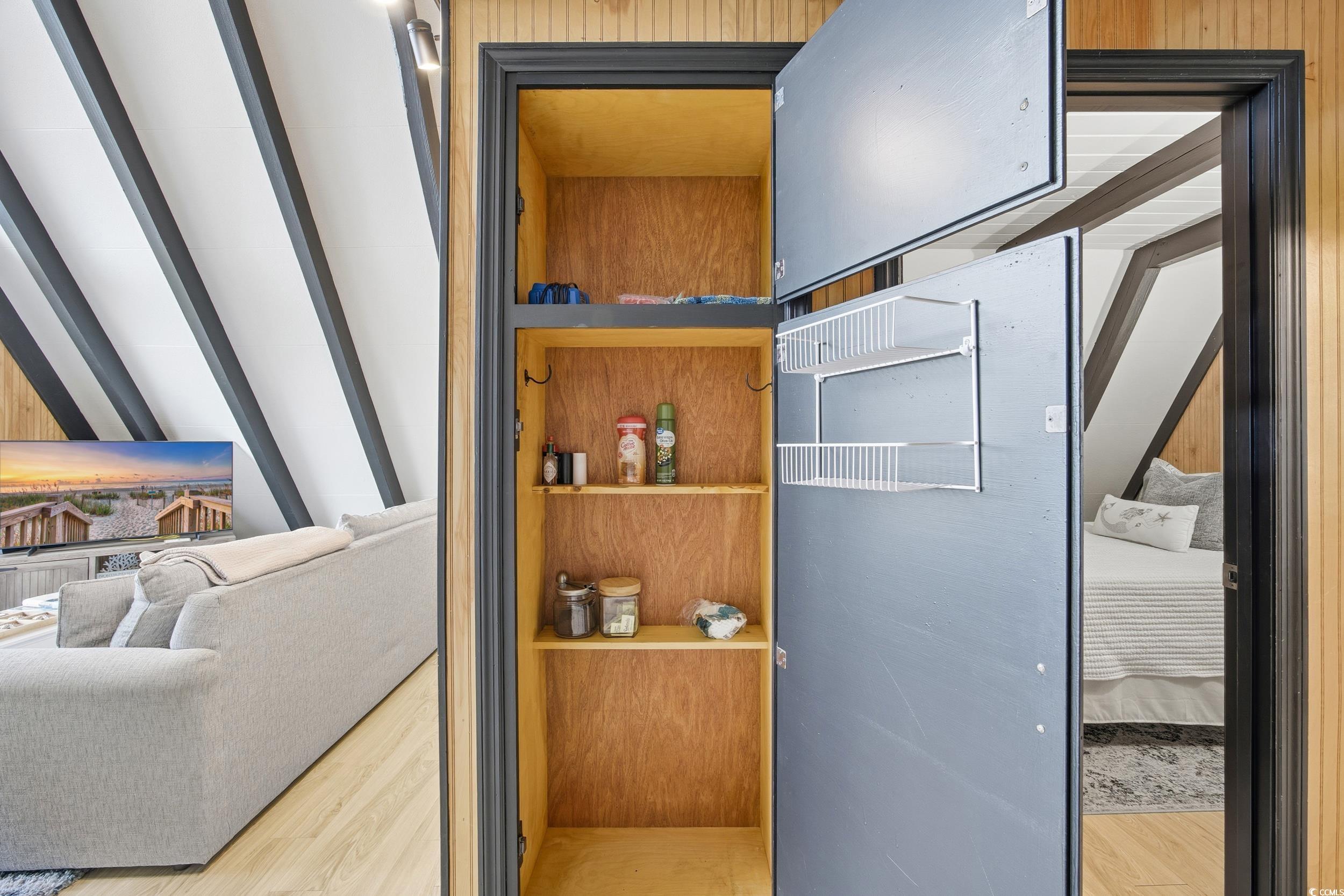 Detailed view of wood finished floors and wooden walls