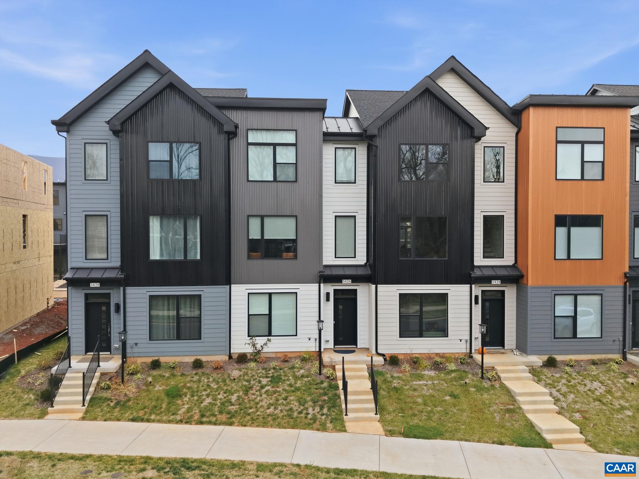 BRAND NEW (2025) End Unit in Crozet’s coveted Old Trail—move in and sparkle for the holidays! Built by respected local builder Southern Development Homes, this home delivers beauty, function, and efficiency. It features premium exterior finishes and a bright, open main level anchored by an oversized kitchen island—perfect for cooking, gathering, or spreading out for work and play. The home comes fully equipped with appliances, including the refrigerator, washer, dryer, and an upgraded range. Enjoy outdoor living on the covered deck, and appreciate thoughtful touches throughout: window treatments, a new shower-head, and a remote-controlled ceiling fan in the workout room. Set in the heart of Old Trail, you’re just a short stroll to the golf course, Restoration restaurant, and the vibrant Old Trail Village with dining, shopping, and ACAC. As an end unit, the home is filled with natural light and enjoys extra privacy with green space directly across the street—plus convenient street parking right out front. This home is also PEARL Gold Certified, showcasing its energy efficiency and year-round comfort. Come take a look today!