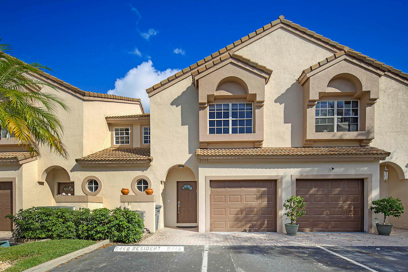Welcome to this beautifully upgraded 3-bedroom, 2.5-bath townhome in the sought-after gated community of Coral Lake in West Boca! Rarely available and full of charm, this light-filled home features an open-concept layout with soaring vaulted ceilings and skylights that create a bright, airy feel from the moment you walk in. Recently refreshed with brand-new flooring, fresh paint, updated baseboards, and smooth ceilings (no popcorn!), it's truly move-in ready. The stylish kitchen shines with solid wood 42'' cabinets, granite countertops, a full granite backsplash, a raised counter bar, and custom cabinetry that adds valuable extra storage. Upstairs, the double-door entry welcomes you into a spacious master suite with a beautifully redesigned master bath. The oversized 2nd and 3rd bedrooms offer incredible space and generous closets&#x14;perfect for guests, family, or a home office. With no rear neighbors, you'll enjoy added privacy and peaceful living in this exceptional home. Every detail was thoughtfully upgraded to maximize comfort, style, and functionality.