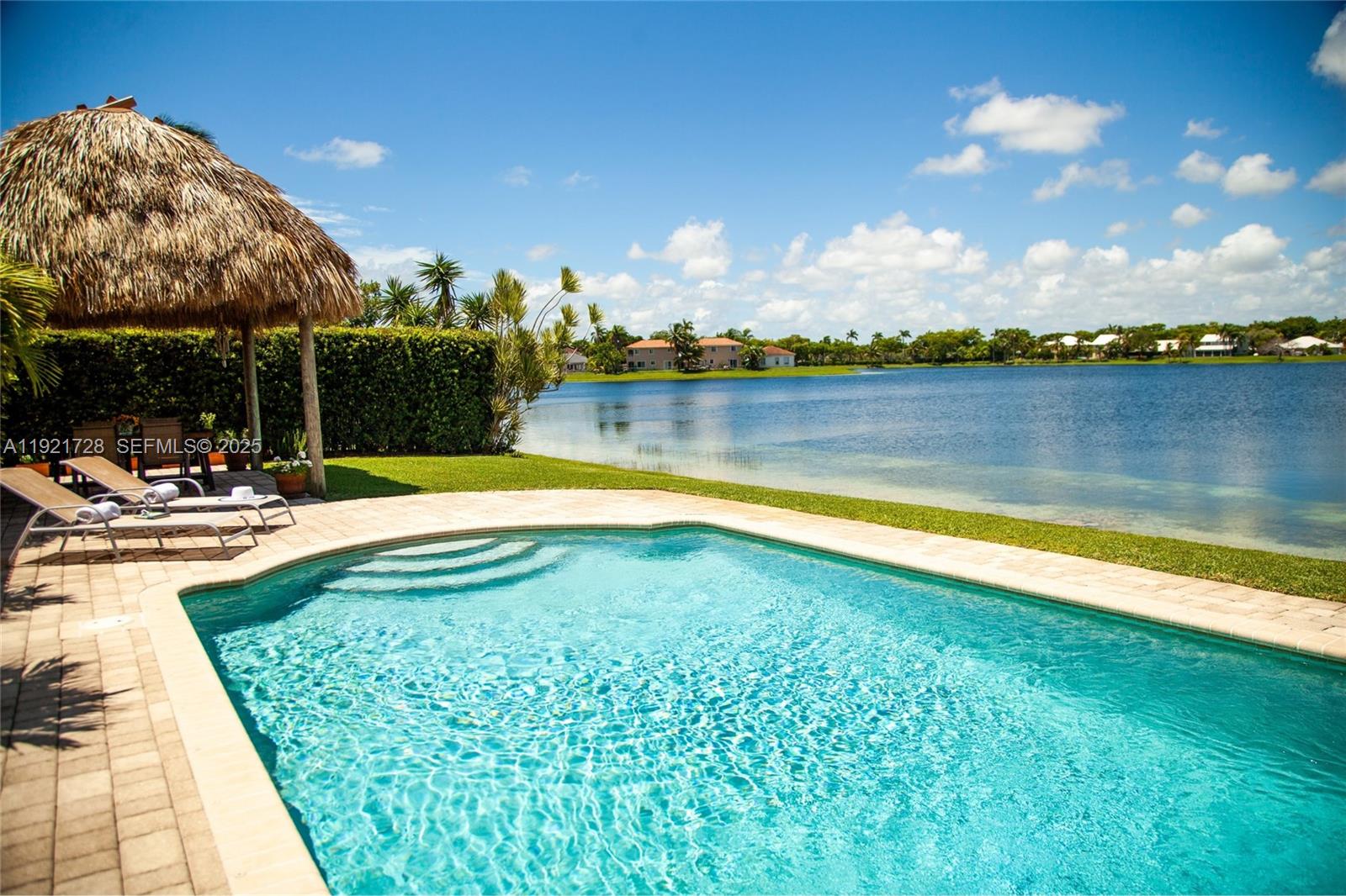 Experience true Florida lakefront living with year-round sunsets!Lakefront pool home offering a calm, open layout and unobstructed water views from the main living areas and primary suite. Bright interiors, natural tones, and wood accents create a warm atmosphere. The backyard features a covered tiki area with fan, perfect for gatherings, plus a portable grill and a Cuisinart griddle on wheels.House features 3 bedrooms + office/flex room, 2 bathrooms, impact protection (accordion and/or impact windows), salt-system pool, sprinkler with well, smart alarm, remote lock, auto-on lights, camera system. Pets OK.Home is sold FULLY FURNISHED with a warm, natural aesthetic and custom wood furniture, including artisan pieces and quality décor. Some art pieces are not included, but all electronics and fixtures are, making this property truly move-in ready and ideal for relocations. Please tour the house through the ATTACHED PHOTOS.HOA is paid quarterly and averages $94/month. It covers lake maintenance and community aesthetics management. Prime location east of Old Cutler Road, close to top schools, parks, and Black Point Marina. Cutler Bay is a booming city in Miami-Dade, with plenty of attractions. The home is located at "Lakes by the Bay" community, close to Turnpike, taking just a 35-minute drive—outside rush hour—to reach Miami International Airport. Built in 1996 under the significantly improved 1994 Building Code. Great opportunity to own this unique home! Easy to show!