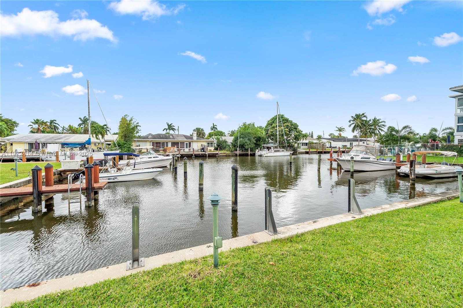 Enjoy peaceful water and pool views from your screened patio in this boutique community, featuring a NEW 2023 roof. The unit itself boasts a modern kitchen with granite counters and stainless appliances, along with a newly upgraded primary bathroom and walk-in closet. Pet friendly with restrictions, private dock for up to 26' boat with straight access to the ocean! Building has reserves, seller's preferred lender financing options available for lowered rates! No rentals allowed.