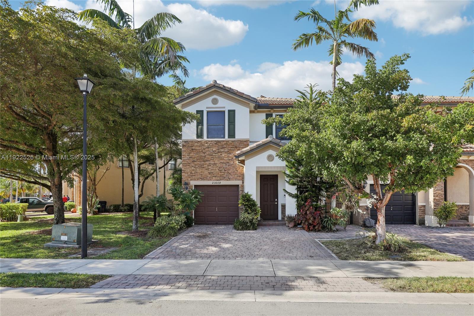 This spacious 5-bedroom, 3-bath corner townhouse in Homestead’s Silver Palm community offers two stories of well-designed living with comfort and convenience throughout. Built in 2013, this corner unit includes one full bedroom and full bath on the first floor, ideal for guests or flexible living needs. With 1,868 sq ft of interior space (2,207 total), the layout features a large open kitchen, generous living areas, and a private paved patio with a covered section perfect for outdoor dining or entertaining. Energy-efficient solar panels are included, along with a 1-car garage and ample guest parking nearby. The 2,571 sq ft lot is low-maintenance and well-positioned within the community. Residents enjoy a super low HOA Fee with access to premium amenities including a clubhouse, pool, clubroom, and barbecue area. Located just minutes from major highways, shopping, and schools, this home combines functionality, space, and a prime Homestead location. Call or text today to schedule your private showing.