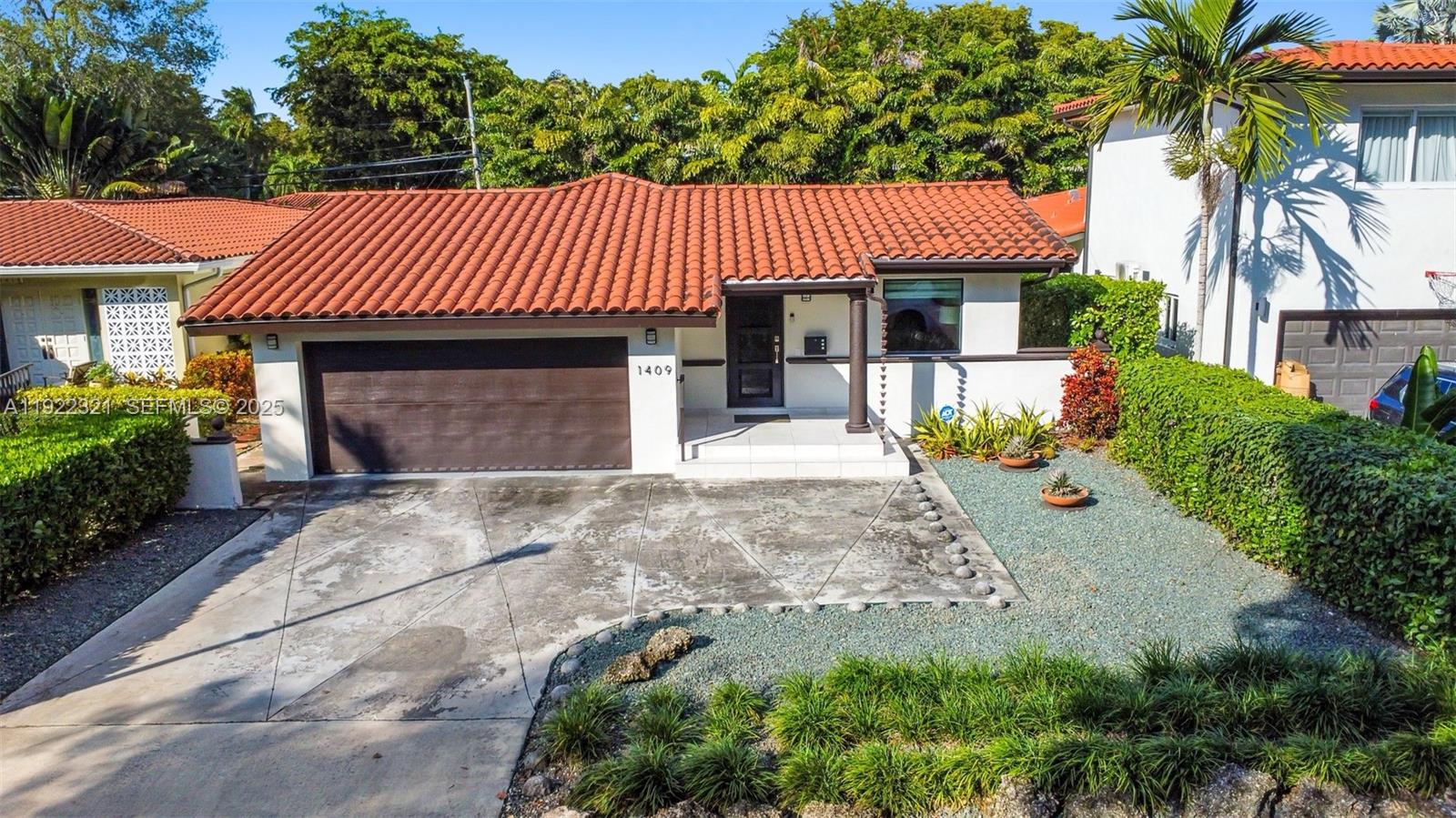 Beautifully remodeled 3-bed, 2-bath home in the heart of Coral Gables! This charming residence offers 1,650 sq ft of bright, comfortable living with refurbished wood floors, a remodeled kitchen with modern finishes, and updated bathrooms done with great taste. The spacious living and dining areas flow seamlessly, creating an ideal layout for everyday living and entertaining.Impact windows throughout provide peace of mind, while the remodeled garage offers improved functionality, storage, and versatility. A two-car garage with electric car charger already installed plus driveway parking for at least two more vehicles adds excellent convenience. Window treatments are installed throughout the home.Step outside to a private backyard with plenty of room to relax, garden, or personalize as your outdoor oasis. Situated on a 6,000 sq ft lot, this property is located just minutes from the best of Coral Gables—shops, dining, parks, and top-rated schools.This move-in-ready home blends timeless Gables charm with thoughtful updates, offering comfort, style, and an unbeatable location.