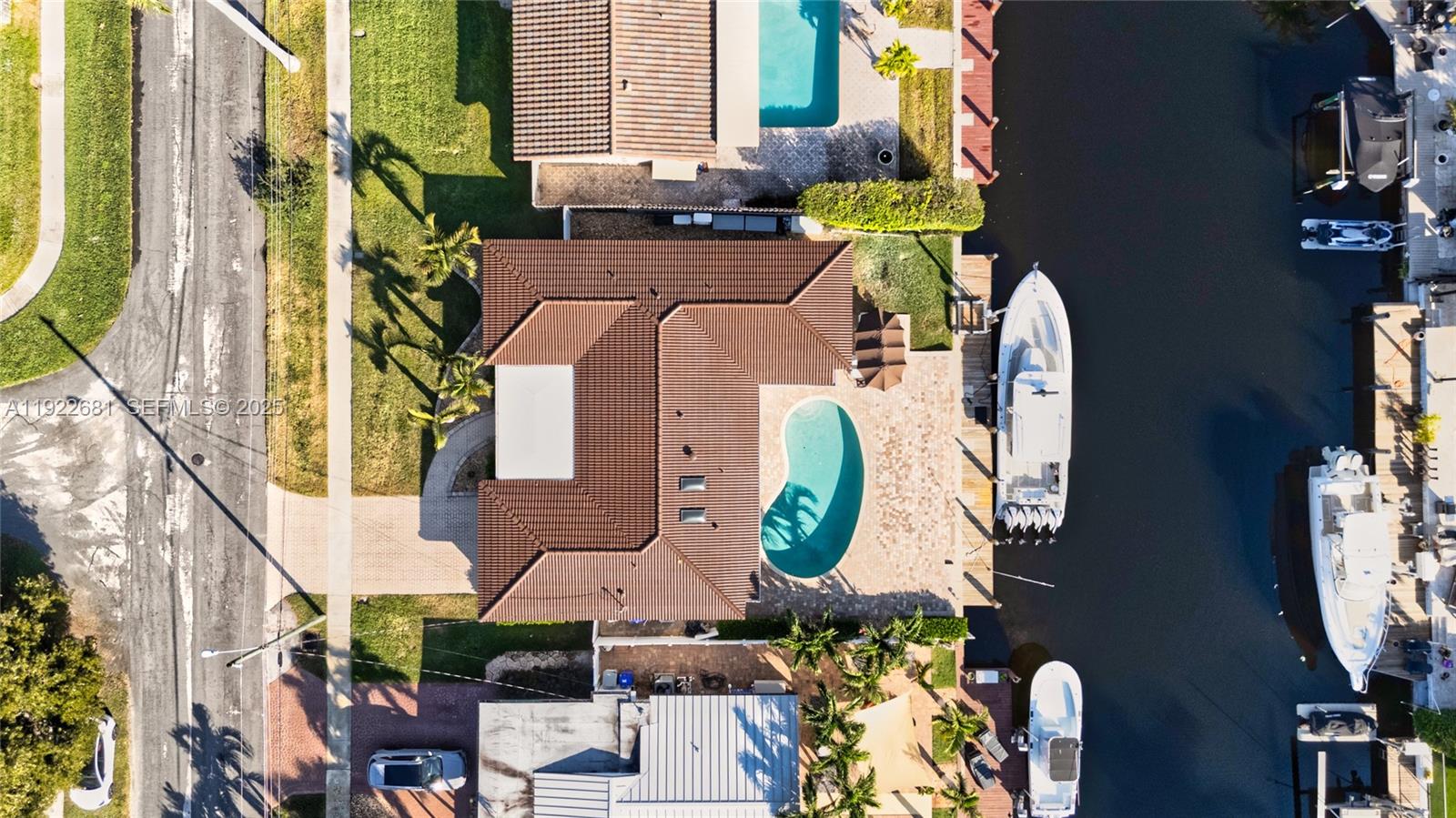 Prime Pompano Beach fully furnished waterfront home. Move-in ready. Features a heated saltwater pool, smart pool pump and 1,500-lb jet ski lift. Protected with impact windows, doors, skylights and a barrel-tile roof with silicone coating. Enjoy natural gas cooking, tankless water heater, new A/C vents, smart-home system, smart sprinkler and PVC plumbing with sleeved line. Split layout with tile, laminate bedrooms, custom closets and Garage Trac flooring. Outdoor living includes a summer kitchen, gas grill, speakers, TV, wood ceilings and a 70’ dock with 2022 seawall footer.