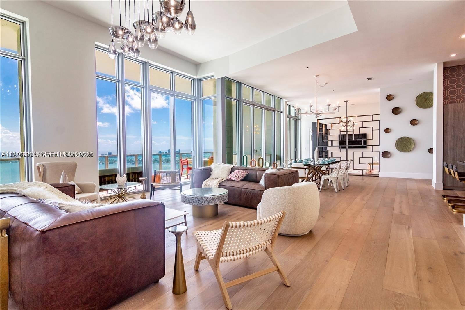 Experience true penthouse living at Biscayne Beach in this spectacular residence soaring above Edgewater. This PH offers breathtaking panoramic views of Biscayne Bay, Miami Beach, and the skyline through floor-to-ceiling impact glass. The open layout features 3 large bedrooms facing the ocean, totaling 5 beds. A sleek modern kitchen with Sub-Zero & Miele appliances, Italian cabinetry, and a spacious island ideal for entertaining. Enjoy private balconies, large bedrooms with custom closets, and spa-inspired bathrooms. Biscayne Beach offers 5-star amenities, including a private beach club, multiple pools, a fitness center, a spa, tennis courts, 24/7 concierge, valet, and more. Located minutes from Design District, Wynwood, Brickell & Miami Beach.