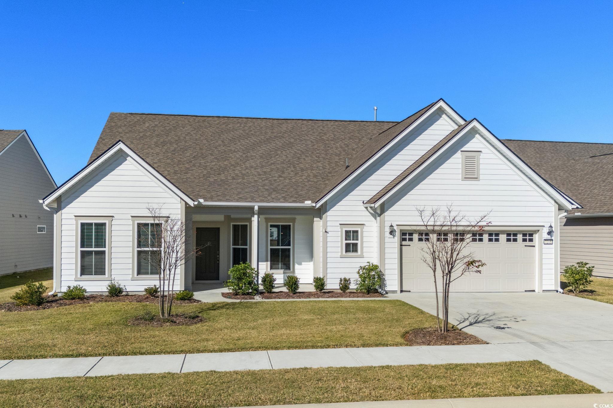 You have found an extraordinary residence in the prestigious Del Webb at Grande Dunes, an exclusive 55+ enclave where luxury living meets coastal serenity. This immaculate 3-bedroom, 3-bath home, completed in 2023 and freshly painted on the exterior, showcases the highly coveted Sonoma Cove floor plan, celebrated for its sophisticated design and seamless blend of open-concept living spaces.  From the moment you step inside, you’re greeted by an atmosphere of refinement. The gourmet kitchen is a true showpiece—featuring polished granite countertops, an expansive entertainer’s island, built-in stainless steel appliances, a designer tile backsplash, and a spacious walk-in pantry. Adjacent, the sunlit dining area and elegant great room create an inviting space ideal for both intimate gatherings and grand entertaining. A large, bright office with double French doors offers an inspiring environment for productivity or relaxation.  This exceptional home captures captivating lake views from several rooms, with a generous screened lanai providing a serene retreat for morning coffee or evening unwinding. The primary suite is a sanctuary bathed in natural light, featuring a spa-inspired bathroom with an extended double vanity, an oversized tiled walk-in shower with a bench, and a remarkably spacious walk-in closet that offers direct access to the laundry room—an everyday luxury.  Thoughtful design extends throughout the home with a split-bedroom layout, offering two additional guest bedrooms and two well-appointed guest baths. One guest bedroom features its own ensuite bath, perfect for visiting family or friends.  Built to today’s highest standards, this home includes modern conveniences such as irrigation, a termite system with bond, gutters, a beverage bar, pull-out kitchen trays, stylish kitchen island detailing with open shelving, and a laundry room with a utility sink. The finished garage is equally impressive, offering a tool bench, tool wall, TV mount, ceiling storage, and tall built-in cabinetry for exceptional organization.  Life at Del Webb at Grande Dunes is truly unmatched. Residents enjoy world-class amenities, including an elegant Amenity Center with daily activities and social events, indoor and outdoor pools, a state-of-the-art fitness center, and courts for pickleball, bocce ball, and tennis. Meandering sidewalks and a scenic paved path along the Intracoastal Waterway invite endless walking and biking adventures. And with golf-cart access to nearby shops and the beach, the ultimate coastal lifestyle is right at your doorstep.  This exceptional home offers not just luxury—but a lifestyle beyond compare.