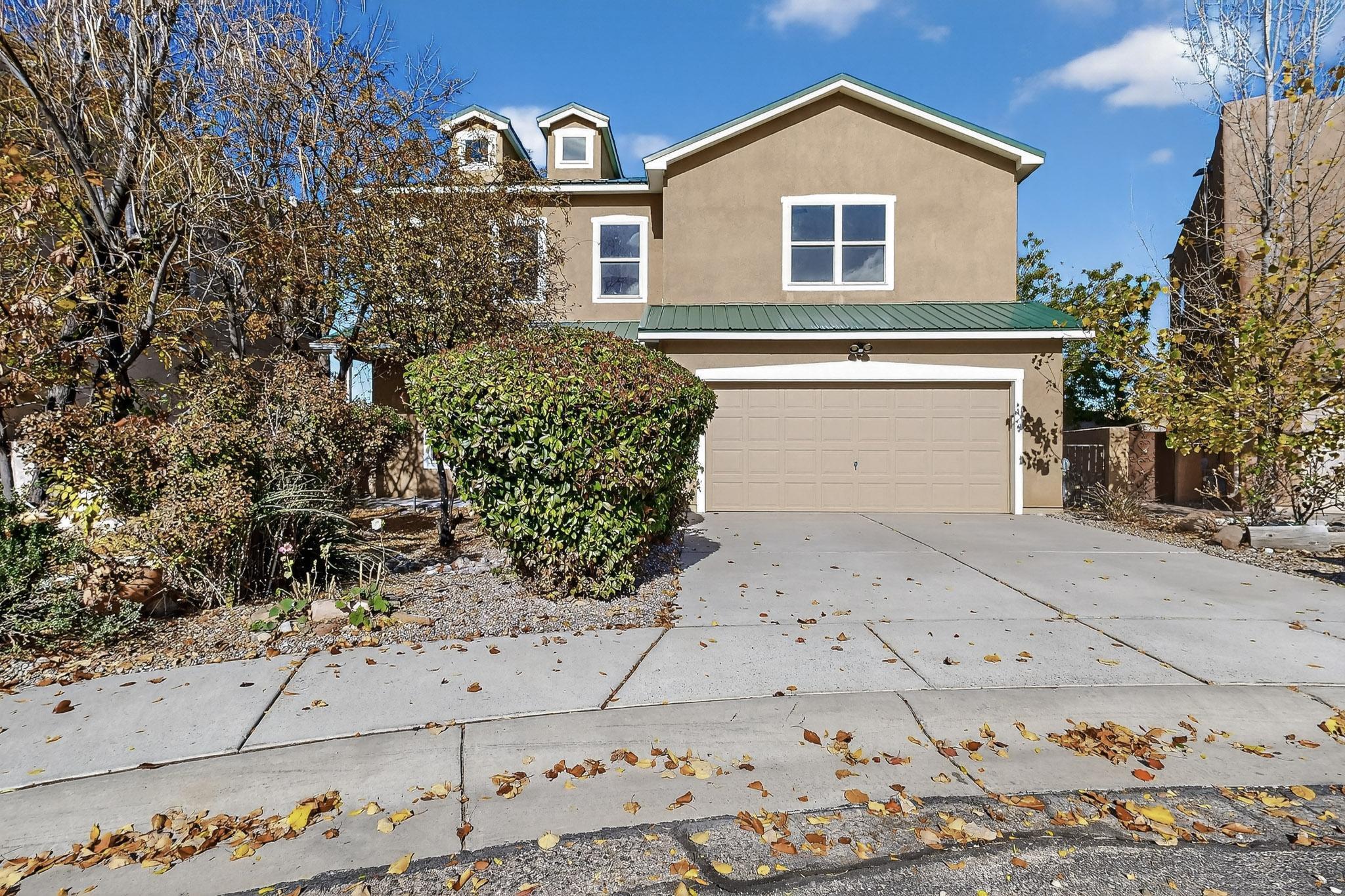 Beautiful, move-in ready, Northern New Mexico style home in gated community. This home has been wonderfully maintained and freshly painted. It has a recent HVAC system with refrigerated air & a new garage door opener. It features a gorgeous, updated kitchen with high-end stainless-steel appliances (check out the fancy icemaker that makes round cubes), granite counter-tops, and designer tile backsplash. The living room has a fabulous gas-log fireplace for cozy evenings. Upstairs is a huge family room, and each bedroom is large and has its own walk-in closet. The sellers enjoyed years of entertaining on the beautiful back patio with a covered porch and lots of greenery. Don't miss the huge closet under the stairs for extra storage. This is a great North Valley property at a terrific price!