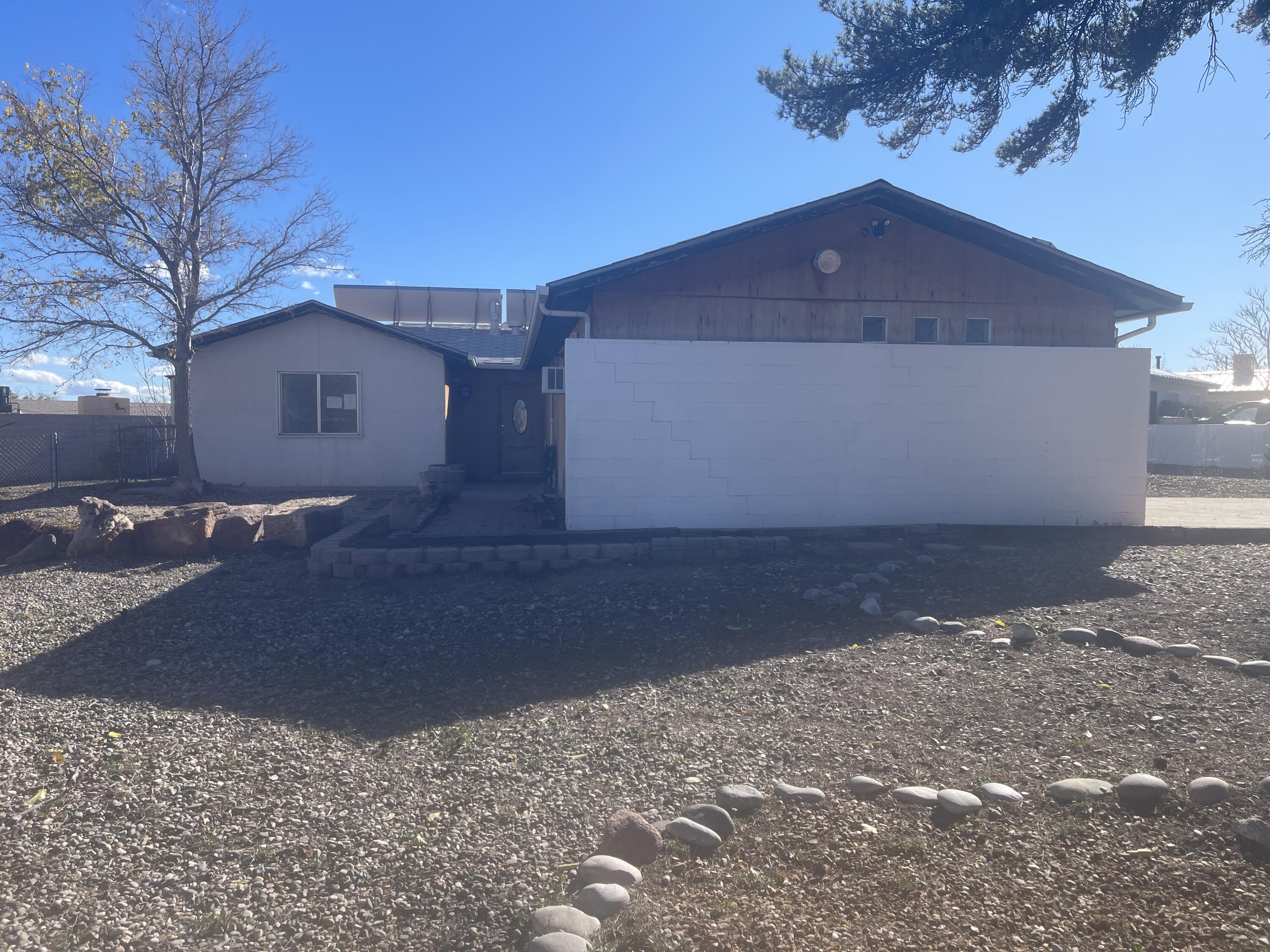 Great corner property located the heart of Rio Rancho. With your special touch this home could be a great opportunity for some sweat equity for a home owner, or a financial opportunity for an investor. This home offers 2 orginal bedrooms with a possiblity of 4 bedooms. The carport conversion does have plumbing for kitchen and bath.