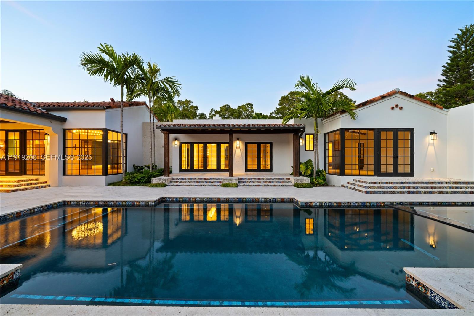 Experience timeless luxury in the heart of Coral Gables, just minutes from dining, shopping, and the historic Miracle Mile. This newly built estate offer 5,358sqft of living space on over half an acre and fuses timeless Spanish character with modern sophistication. Vaulted ceilings with exposed beams crown a dramatic great room wrapped in corner windows and steel-frame glass doors that erase the boundary between indoors and out.The showpiece chef’s kitchen centers on a custom L’Atelier range and marble surfaces, complemented by Sub-Zero refrigeration and wine cooler, a Wolf oven, and a built-in Miele coffee system. Spa-level bathrooms feature striking marble and Waterworks fixtures, while an integrated Lutron smart system unifies lighting, ambiance, and control throughout the home. The serene primary suite includes a private midnight kitchen with a second Miele coffee station and peaceful garden and pool views.Resort-style living continues outdoors with expansive terraces, a heated saltwater pool, hot tub and a fully equipped summer kitchen for effortless entertaining. A private guest house with full kitchen, bedroom, and bath offers exceptional flexibility for guests or extended stays. A legacy estate built without compromise. Schedule a tour today!