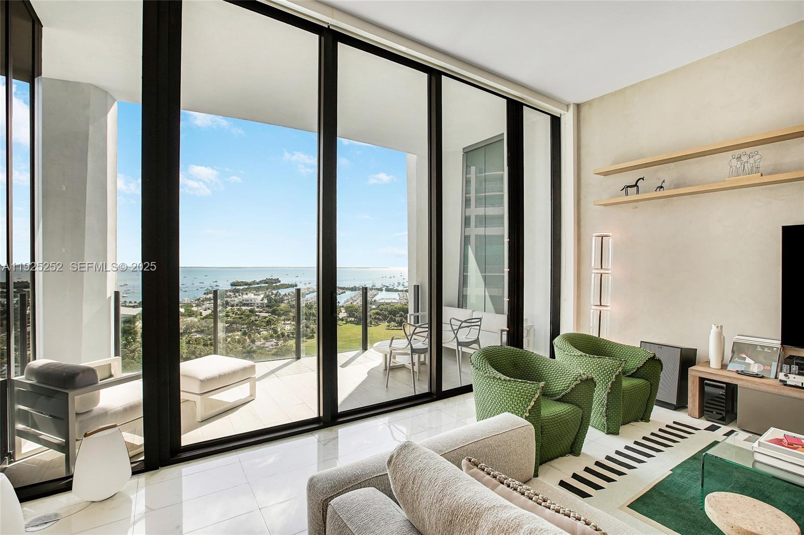 Experience the ultimate in luxury living in Coconut Grove with this exquisite 15th-floor residence at Two Park Grove. This rarely available C-line unit offers unparalleled views of Biscayne Bay, perfectly framed by soaring 12-foot floor-to-ceiling windows. The residence features three bedrooms, enhanced with upgraded finishes, custom wood paneling, cabinetry, and a private elevator entry, ensuring the highest level of exclusivity.Step out onto the oversized terrace accessible from both the primary bedroom and the living room to enjoy stunning sea views. Two Park Grove is synonymous with luxury, offering amenities akin to the world's most exclusive private clubs. Residents enjoy the services of a concierge, 24-hour valet, a state-of-the-art fitness center, a signature spa, a children's playroom, a movie theater, a wine cellar, and a private dining room and more.This location offers the perfect blend of convenience and sophistication, just minutes away from exceptional shopping, dining, and top-rated schools, with easy access to the vibrant Brickell district. Discover a lifestyle in Coconut Grove like no other, offered exclusively by this exceptional building.