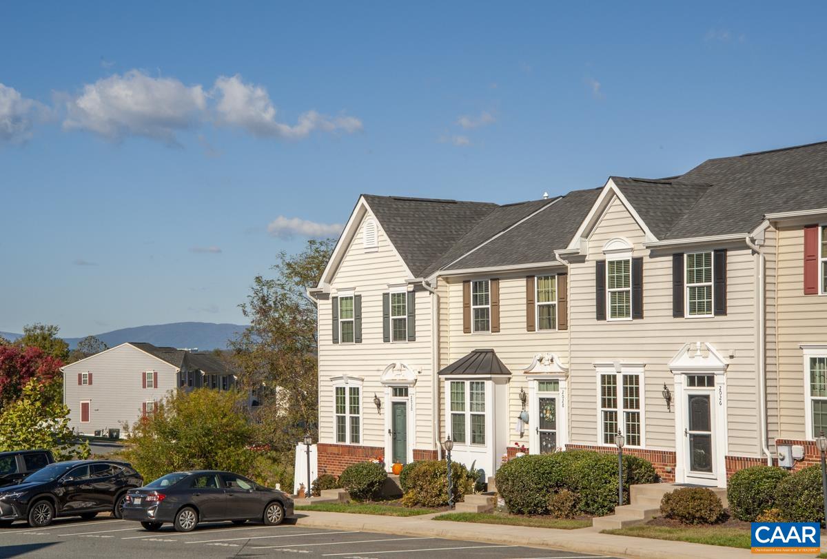 Very rare Towne Home at the Pavilions at Pantops. This unique Strauss model was built only a handful of times here and this one has all the upgrades. The views out back are breathtaking with no homes behind you. The 6 foot extension on all 3 levels creates an incredible kitchen, great room, fabulous primary bedroom and massive basement family room. The kitchen with loads of cabinet space, granite tops and 8 foot island is what we see in luxury homes. Hardwood floors welcome you at the entry foyer then extend through the living room, kitchen and great room which opens to the deck with nature and those beautiful mountain views. The amazing primary bedroom has a tray ceiling, walk-in closet, beautiful en-suite with large double bowl antique white cabinet, granite top, soaking tub and gorgeous tile shower all with bronze fixtures throughout. Finishing out the rest of the 2nd level is a small nook in the hallway for sitting space, two other guest bedrooms, full guest bath (rarely used, with linen closet) and a full laundry room not a closet. The basement has a designated home office with double french doors, a half bath and the largest family room we've ever seen in a townhome. Walkout to the views and imagine the possibilities.