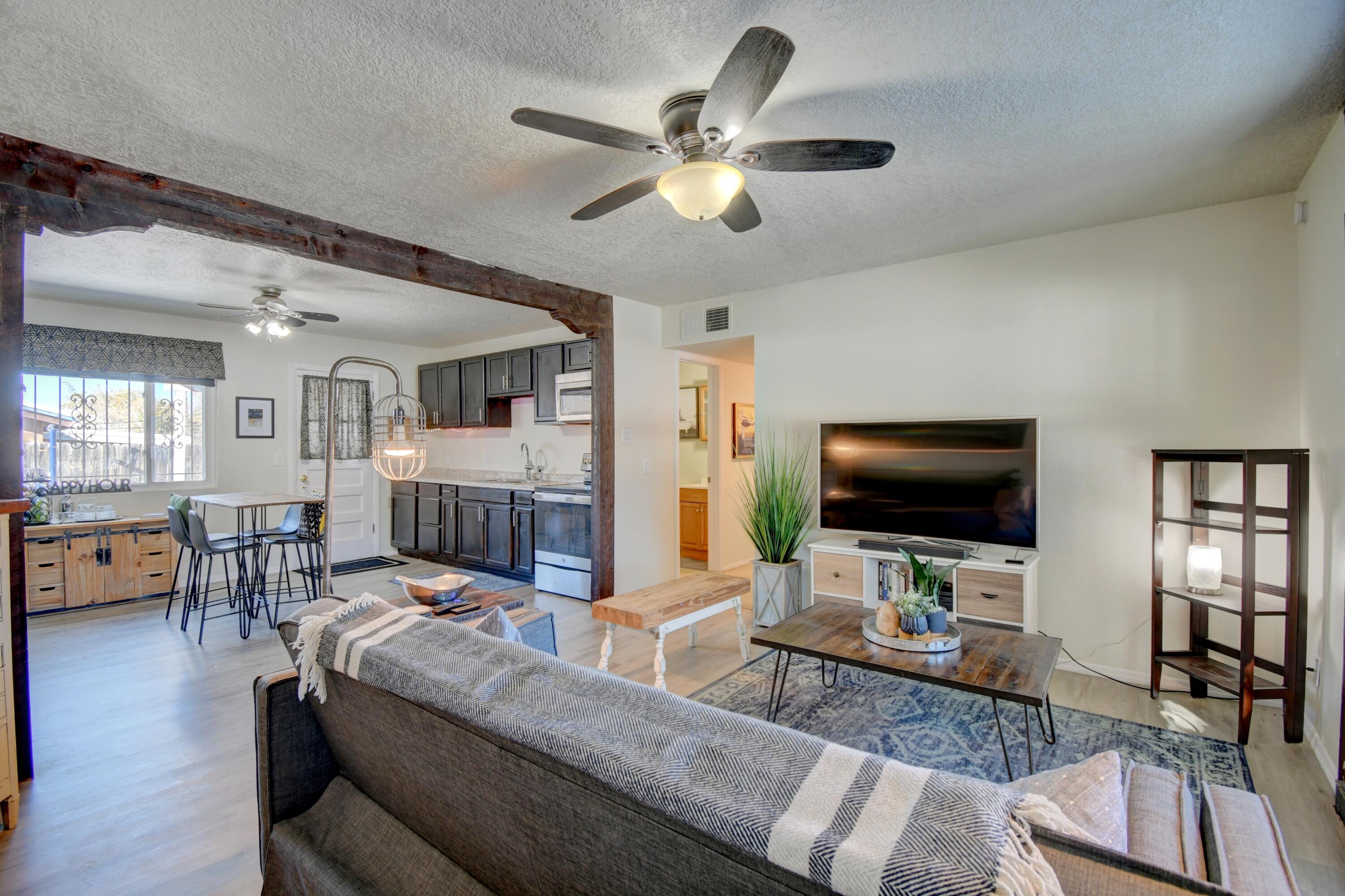 Good things come in small packages--and this one is a cutie! In a perfect location with quick I-40 access, close to the Air Force base, shopping, restaurants, and stunning mountain trails. Updates since owning include carpet in bedrooms, an improved electric panel, + refrigerated AC/furnace, and great overall maintenance. The oversized garage offers tons of storage and potential. All appliances convey. Enjoy the covered patio, fenced yard, and charming bay-window seat--just sit for a moment and picture yourself at home. Easy to keep spotless with its tidy, efficient layout. Don't miss this gem!