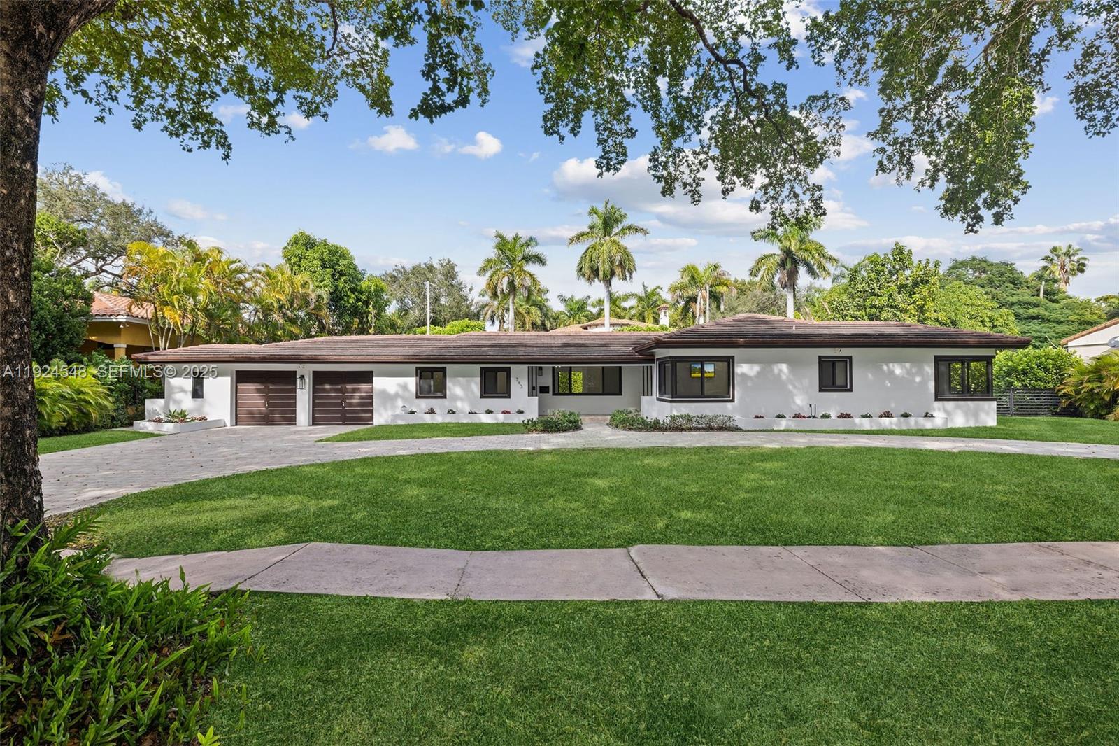 Experience exceptional living in the Golden Triangle of Coral Gables! This lovely home features 3 bedrooms, 3 baths, and a versatile 4th room that can serve as a bedroom, office, or playroom. An oversized 2-car garage, indoor laundry room, and a spacious circular driveway add convenience. Enjoy outdoor entertaining with a covered terrace, complete with an outdoor cook prep area with sink, ice maker, and wine and beverage refrigerator. Elegant patio furniture included. Relax by the oversized saltwater pool or play soccer or throw the ball around in the large yard with mango, avocado and guava trees. Home has impact doors and windows, an alarm system, and exterior Ring cameras. Three mounted TVs are included for your enjoyment. This home is available for lease—experience Coral Gables living at its best!  A Very Special Home.