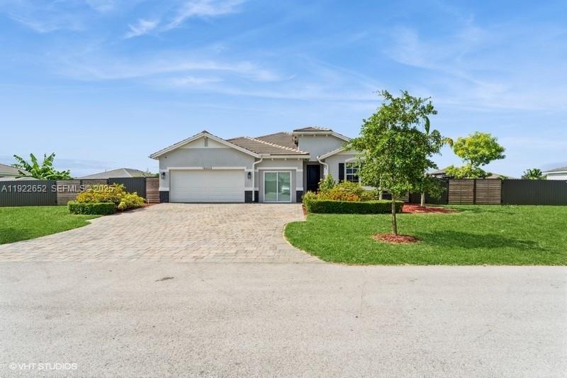 Discover this beautifully upgraded 4-bedroom, 3-bath home in the sought-after Las Palmas community of Homestead2, this 2,551 sq ft residence offers modern . Built in 202design, an open layout, and turnkey convenience—without the wait or cost of new construction. Enjoy a bright, open concept living space featuring a custom entertainment wall and an upgraded kitchen with a redesigned pantry and custom shelving. The primary suite includes a walk-in closet and elegant en-suite bath, while an additional en-suite bedroom is ideal for guests or multigenerational living. A 3-car garage with built-in storage adds exceptional functionality. Outside, the expansive backyard features mature fruit trees, a storage shed, and a covered patio—perfect for relaxing or entertaining. With plenty of room for a pool, outdoor kitchen, or garden oasis, the possibilities are endless. Located in a quiet, well-maintained neighborhood near shopping, dining, top-rated schools, and major highways, this home offers elevated living at its finest.Schedule your private tour today—this Las Palmas gem won’t last!