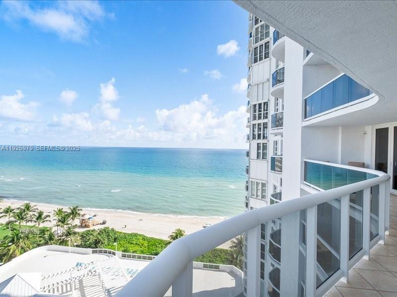 Live oceanfront at Sandpointe in North Miami/ Sunny Isles Beach. This stunning 2 bedroom + Den (with closet), 2 bath Unit features 1,820 Sq Ft, a large private terrace, and direct ocean + city skyline views throughout with floor to ceiling windows. Balcony access from bedrooms, kitchen and living room. Lots of natural light. Oversized Primary Bedroom, Closet and Bathroom. The building sits directly on the ocean with direct beach access, elevator down and just steps to the sand. Amenities include: 24-hr security, concierge, oceanfront pool and sun deck, gym with ocean views, spa (sauna + steam rooms), billiards, theater room, business center, library, community/social rooms, valet parking, guest valet, EV charging, and pet-friendly building. Prime location close to dining, markets, parks, and top shopping including Bal Harbour Shops and Aventura Mall. Ideal for full-time living or a beach home. Unit has impact windows and storage unit.