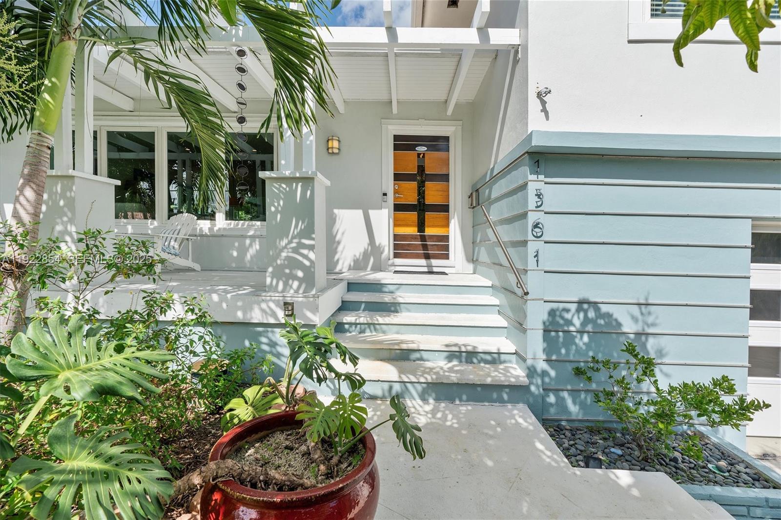 Resort-style pool and outdoor entertaining at 1361 104th St - Home in Miami Shores