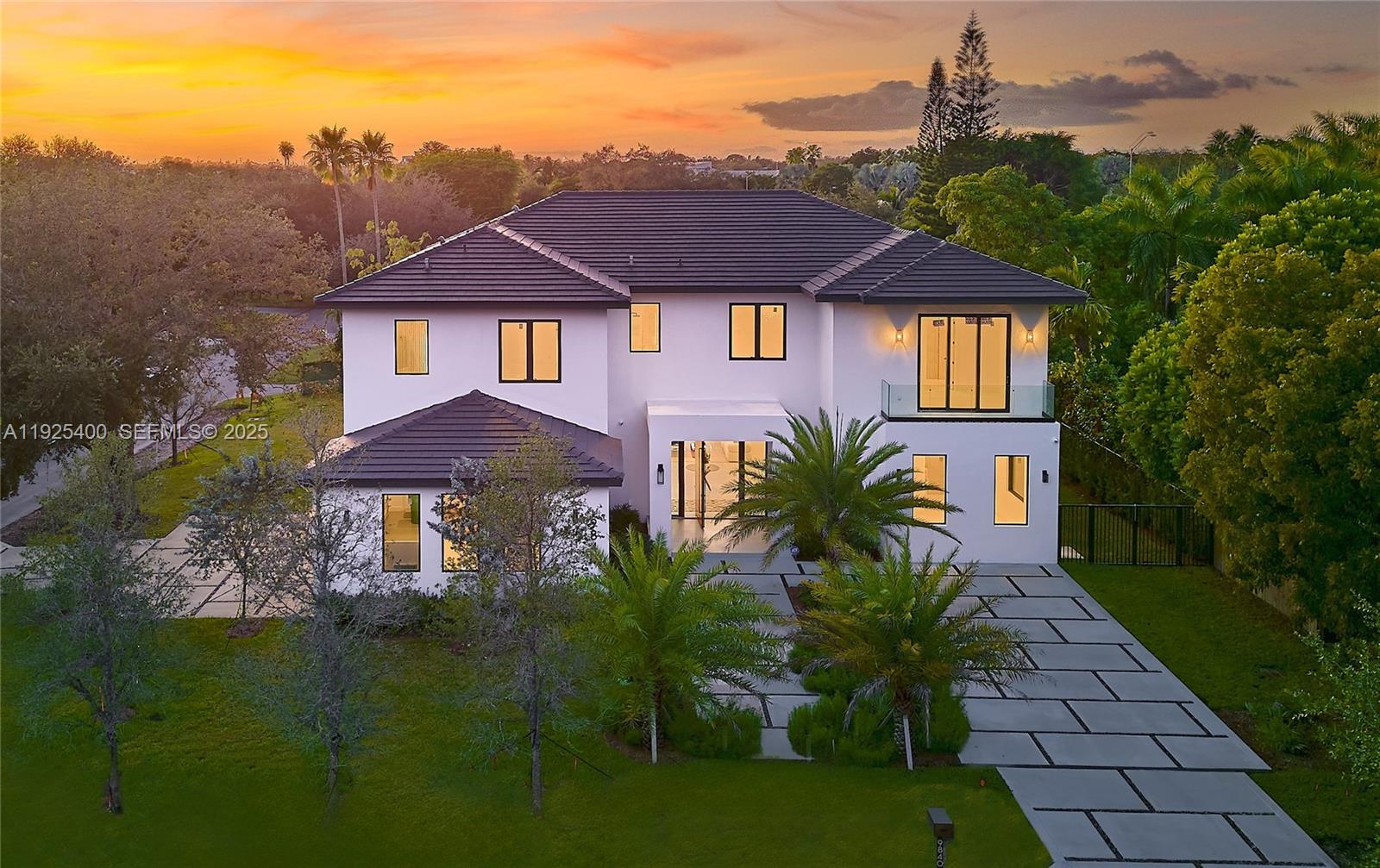 New Construction 2025 in North Pinecrest. Experience Pinecrest living at its finest in this classic-with-a-modern-twist masterpiece, offering 8,143 sq. ft. of total construction and 6,841 sq. ft. under A/C. Perfectly positioned on a 15,225 sq. ft. corner lot, this 6-bed, 7.5-bath luxury residence was designed for those who appreciate sophisticated craftsmanship, elevated design, and effortless indoor–outdoor living. Step into a home bathed in natural light, enhanced by expansive windows and double-height panoramic views in the main living room. The open layout is complemented by a chef-inspired kitchen featuring top-tier luxury appliances, wolf and subzero, an oversized island, and a walk-in pantry. The resort-style backyard offers a sparkling saltwater pool, heated spa/jacuzzi, sun-drenched terraces, and generous outdoor areas ideal for entertaining. A car enthusiast’s dream, the property includes a 3-car garage with lift capability plus an additional 11-car driveway capacity. Retreat to the massive primary suite, a true sanctuary with a spa-inspired bathroom featuring a wet room, dual vanities, and a spectacular custom oversized closet that feels like its own boutique. Each Suite offers ample space, en-suite bathrooms. Every detail was thoughtfully curated, including the integration of Valentina Bilbao’s fine art, perfectly complementing the home's architectural elegance. A rare opportunity to own a brand-new luxury residence in one of Pinecrest’s best location.