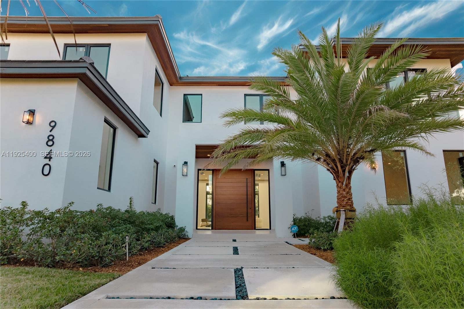 New Construction 2025 in North Pinecrest. Experience Pinecrest living at its finest in this classic-with-a-modern-twist masterpiece, offering 8,143 sq. ft. of total construction and 6,841 sq. ft. under A/C. Perfectly positioned on a 15,225 sq. ft. corner lot, this 6-bed, 7.5-bath luxury residence was designed for those who appreciate sophisticated craftsmanship, elevated design, and effortless indoor–outdoor living. Step into a home bathed in natural light, enhanced by expansive windows and double-height panoramic views in the main living room. The open layout is complemented by a chef-inspired kitchen featuring top-tier luxury appliances, wolf and subzero, an oversized island, and a walk-in pantry. The resort-style backyard offers a sparkling saltwater pool, heated spa/jacuzzi, sun-drenched terraces, and generous outdoor areas ideal for entertaining. A car enthusiast’s dream, the property includes a 3-car garage with lift capability plus an additional 11-car driveway capacity. Retreat to the massive primary suite, a true sanctuary with a spa-inspired bathroom featuring a wet room, dual vanities, and a spectacular custom oversized closet that feels like its own boutique. Each Suite offers ample space, en-suite bathrooms. Every detail was thoughtfully curated, including the integration of Valentina Bilbao’s fine art, perfectly complementing the home's architectural elegance. A rare opportunity to own a brand-new luxury residence in one of Pinecrest’s best location.