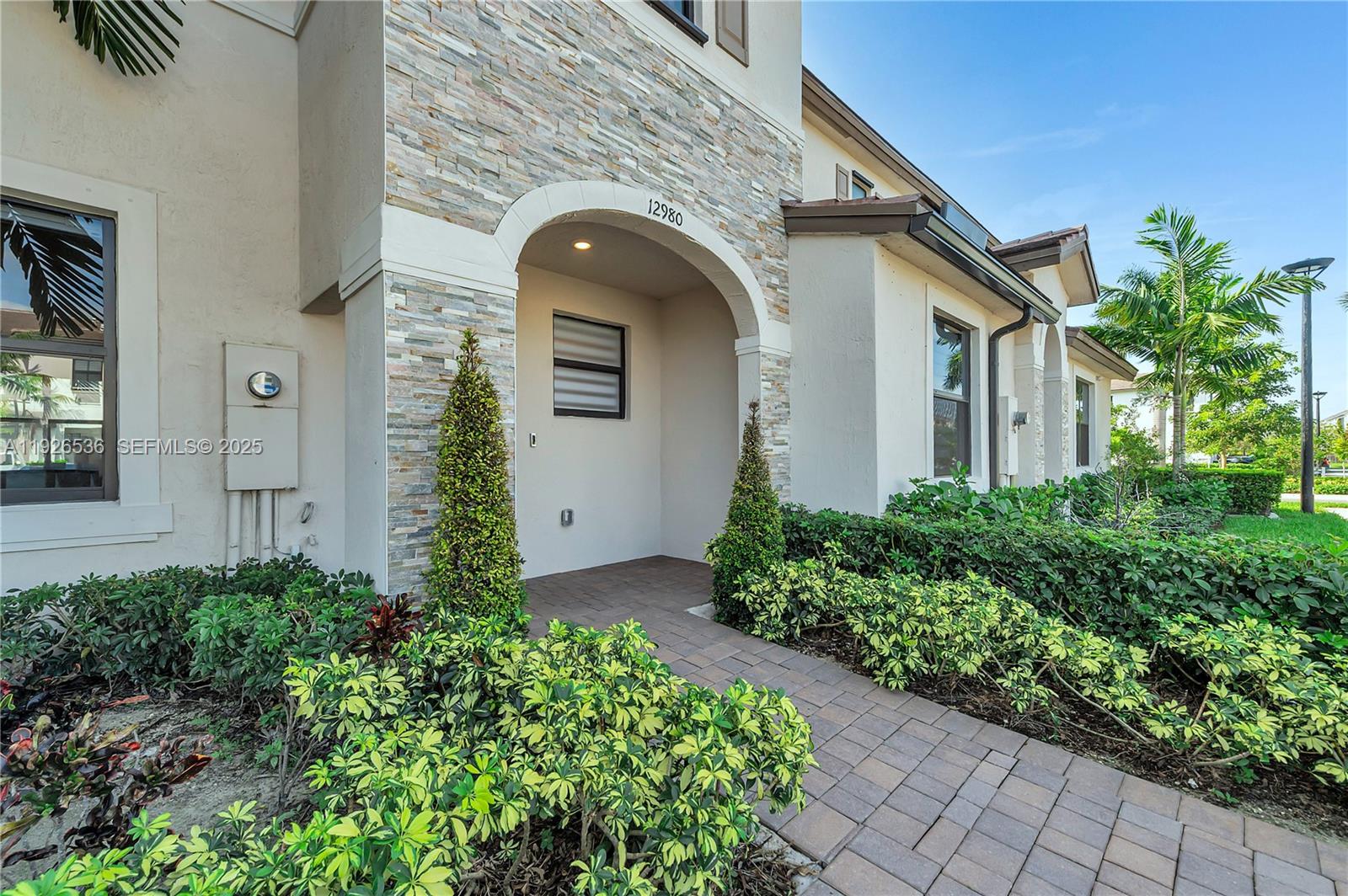 South Florida living at its best! This former builder model has never been lived in and is perfect as a starter home, second home, or investment. The 3BR/2.5BA layout offers modern comfort with a sleek kitchen featuring stainless steel appliances, a fenced rear yard, and a spacious primary bath with walk-in shower. Furniture not included but negotiable. This home also provides Impact Glass windows and doors. Enjoy affordable HOA fees and great amenities including a clubhouse, fitness center, pool, and tot lot. Square footage approximate.