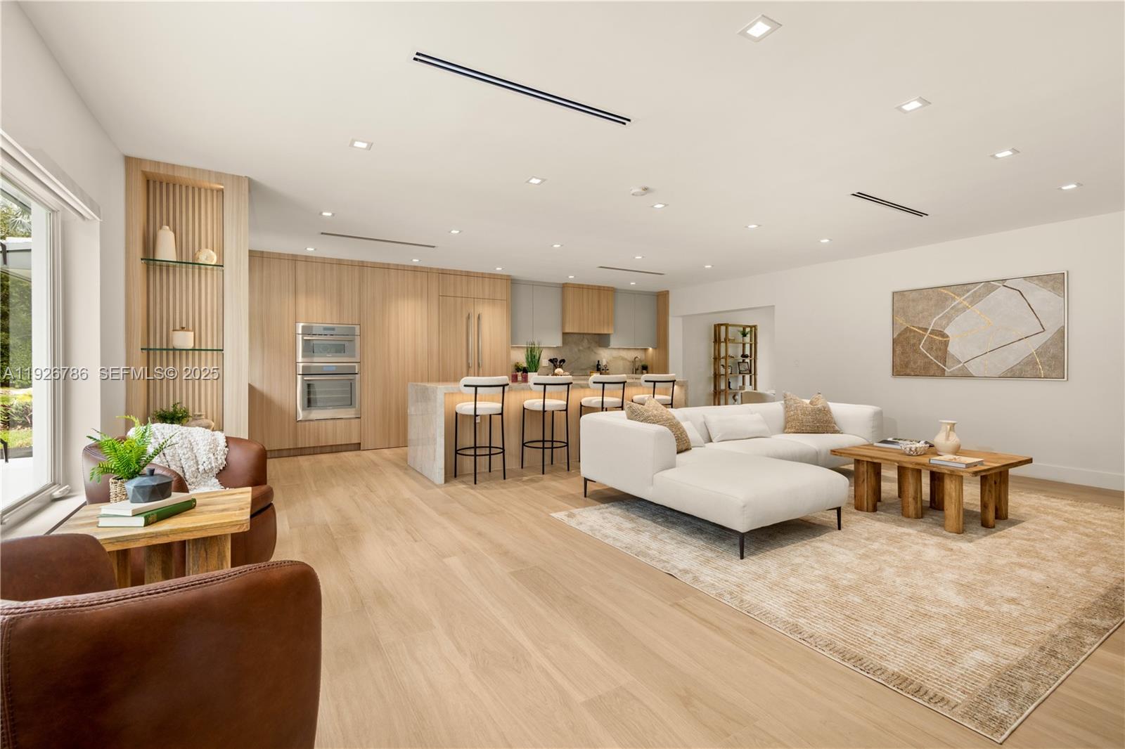 Discover a spectacular move-in ready home in the highly coveted South Gables. This 3-bedroom, 2-bath peaceful oasis exudes calmness and serenity from the moment you walk in with 2,536 adjusted square feet of elegant space on an expansive 11,000 sq ft lot with spacious 2-car garage and circular driveway. This home has been completely remodeled with new roof, impact windows/doors, and high-end finishes including  a stunning open kitchen equipped with Thermador appliances, a new 5-ton A/C system with linear vents, new electrical and PVC plumbing, modern designer bathrooms, and custom closets throughout. A seamless blend of comfort and sophistication, this residence delivers elevated Coral Gables lifestyle at its finest. Fall in love with the mature oaks surrounded by artificial turf and putting green in the back yard with plenty of room to expand. Located on a beautiful tree-lined street, walking distance to University of Miami and Jaycee Park, this home is minutes from Coconut Grove, Merrick Park and the best schools in Miami. This gem has been crafted for discerning buyers seeking quality and design.