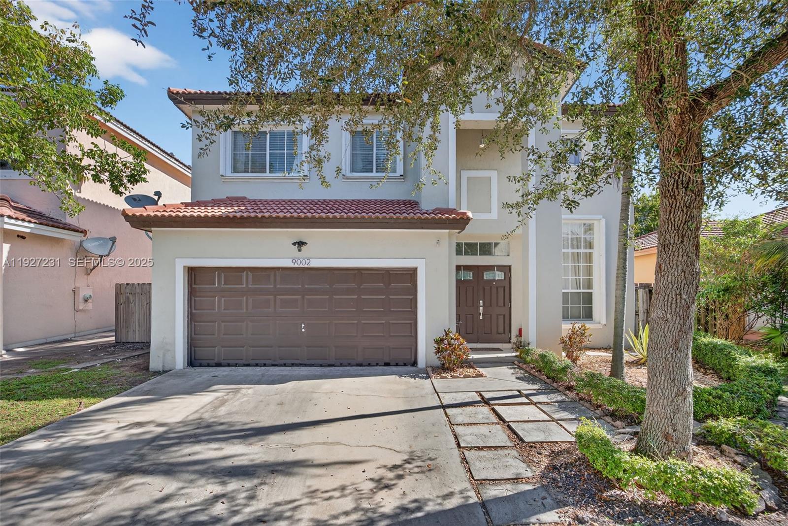 2-Story Single-Family home in Lakes by the Bay, Cutler Bay! Features a 2-car garage, hurricane shutters, double-door entry, and high ceilings. Tile flooring on the first floor and wood laminate upstairs. The kitchen offers stainless steel appliances, ample cabinetry, and overlooks the family room. The primary bedroom includes a walk-in closet and an en-suite bath with a soaking tub and separate shower. Enjoy a covered patio with a ceiling fan, perfect for entertaining. HOA includes access to the community pool and clubhouse.