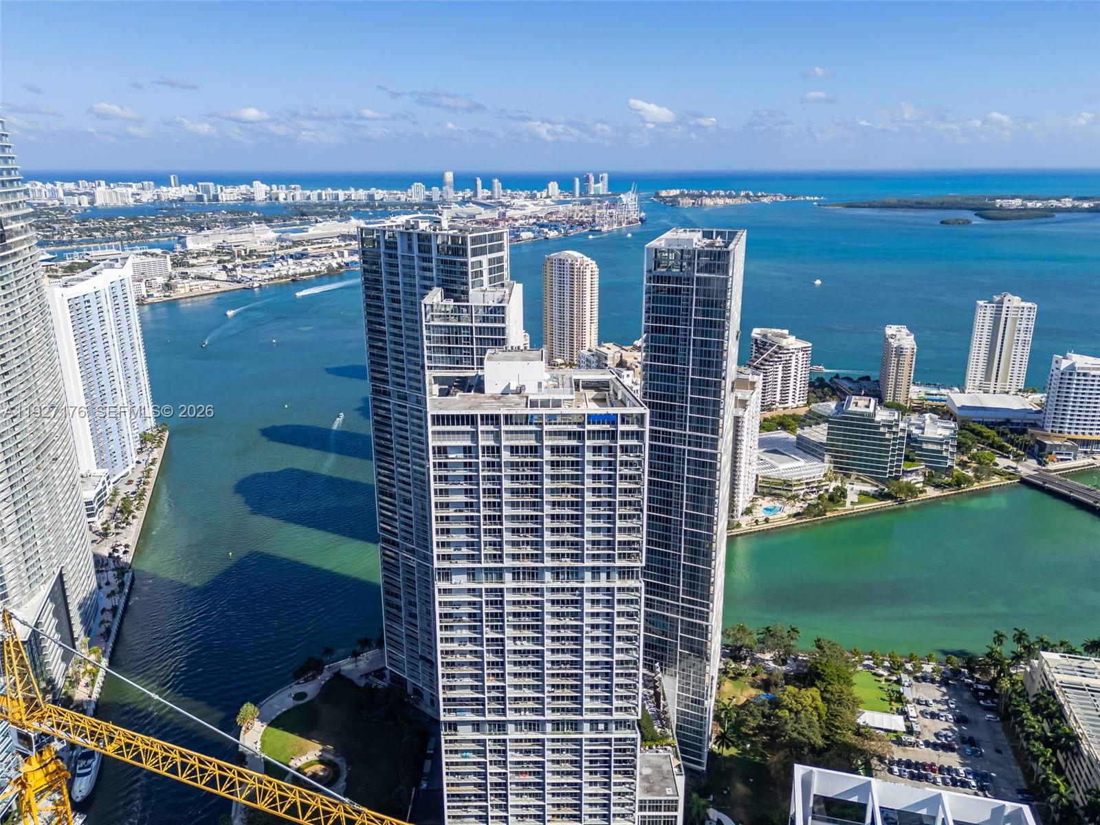 One of the most iconic buildings in South Florida designed by Arquitectónica with interiors by Philippe Stark . Best line in the building with spectacular views of Brickell Key, Biscayne bay and Skyline, from every room. Featuring a balcony ideal for entertaining. Split floor plan with 2 bedrooms, 2 bathrooms, plus a den.This den can be used as an additional bedroom or a TV room.High-end Miele and Subzero kitchen appliances . Marble floors throughout. Custom-made walk-in closets and window treatments. The building offers state-of-the-art amenities: a 300-ft swimming pool, a 50-ft person hot tub, spa/fitness center, game room, poolside café, on site restaurants and 24-hour full-service concierge/valet parking. Steps from Brickell Key City Center, world class dining, shopping and entertainment. Cable and internet included. One assigned parking space. Sold unfurnished. Easy to show.