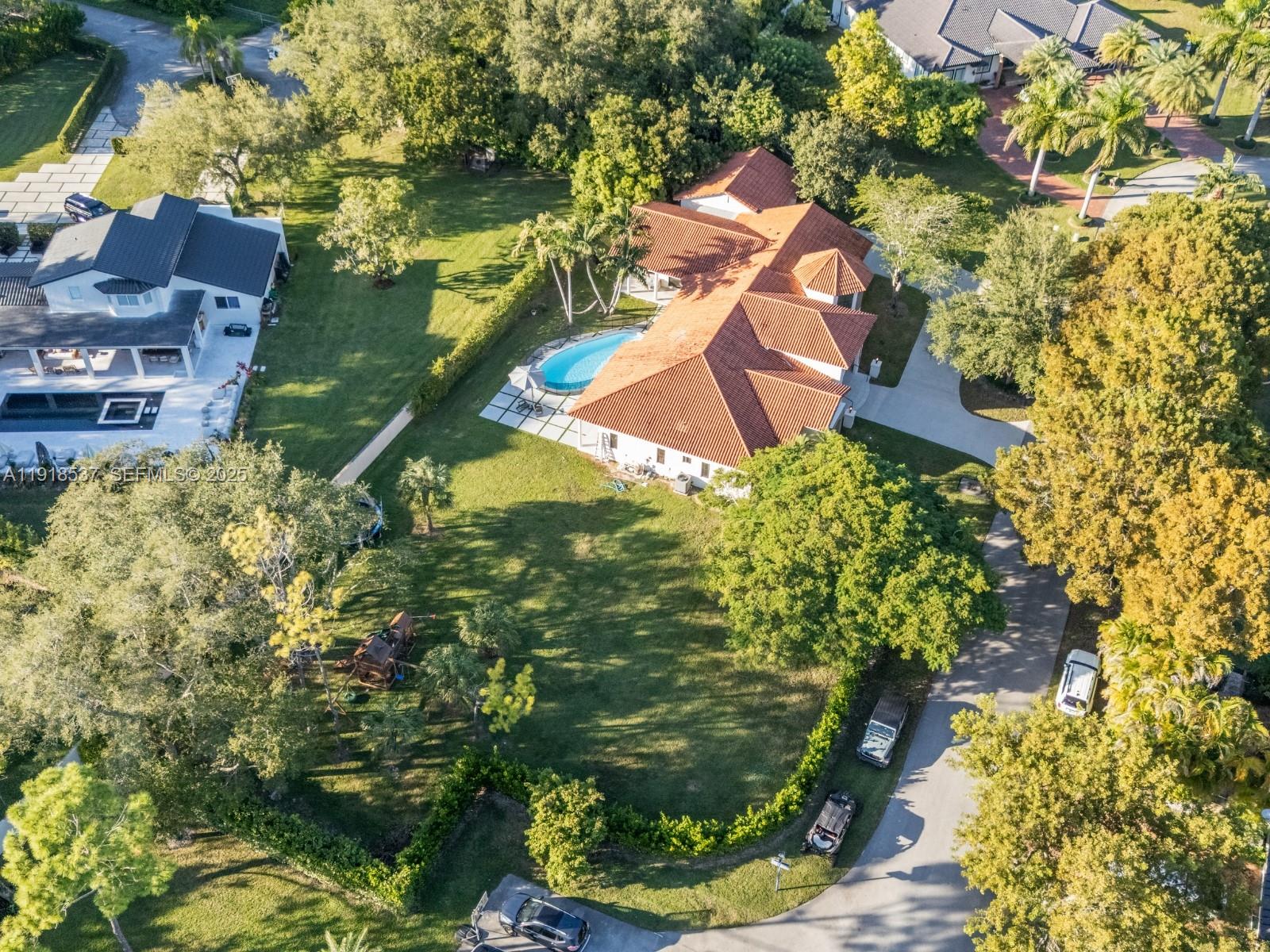 3,932 square feet of pure living area! (More than tax roll) Imagine coming home to a warm-modern 6-bed, 6-bath home on a private 29,000 sqft lot, straight out of a Pinterest board. Completely redesigned and remodeled, this home has everything you could want! The chef's kitchen features custom wood cabinetry with brass accents, a curved industrial-scale hood, leathered stone, luxury appliances and a butler's pantry right behind perfect for any soiree! The primary suite is a serene retreat comprised of beautiful millwork, his and hers California closets, french doors to the pool area and a spa-inspired bath. The split layout conveniently includes 4 beds and 3 baths on one end of the house while the other wing includes the office room, playroom/den and private bedroom suite ideal for guests. Impact and UV-filtered windows/doors fill the home with natural light while keeping it private and secure. Integrated sound system throughout the home and terrace make for effortless gatherings. Outside you'll find the refreshed pool, lush landscaping, convenient cabana bath and expansive yard with room to build the court of your dreams. 2 car garage for ample storage and large circular driveway. Updated plumbing and electrical. Sits on a quiet U street providing extra privacy. Come experience Palmetto Bay living! Move in ready... just bring your golf cart!