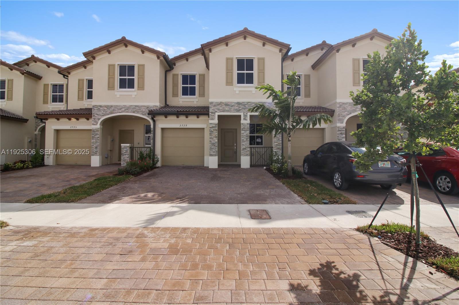 Brand-new two-story townhome for rent offering 1,828 sq ft of living space with 4 bedrooms, 2 full bathrooms and 1 half bath. Never occupied and ready for first tenants. The first floor features a separate living room and dining room, providing defined spaces for everyday use or entertaining. The open kitchen connects to the family room and opens to a covered patio with a lake-view backyard, offering privacy and outdoor space. Upstairs includes a spacious primary bedroom with in-suite bathroom and three additional bedrooms, all with ample closet space. Full-size washer and dryer area, one-car garage, and additional driveway parking. New construction finishes throughout. Located in a quiet, well-planned community with access to amenities including clubhouse, fitness center, swimming pool, tennis courts, BBQ areas, golf course and parks. Minutes to Publix, Homestead High, and Fl Turnpike. Just a short drive to the FL Keys! Move-in ready with immediate availability.