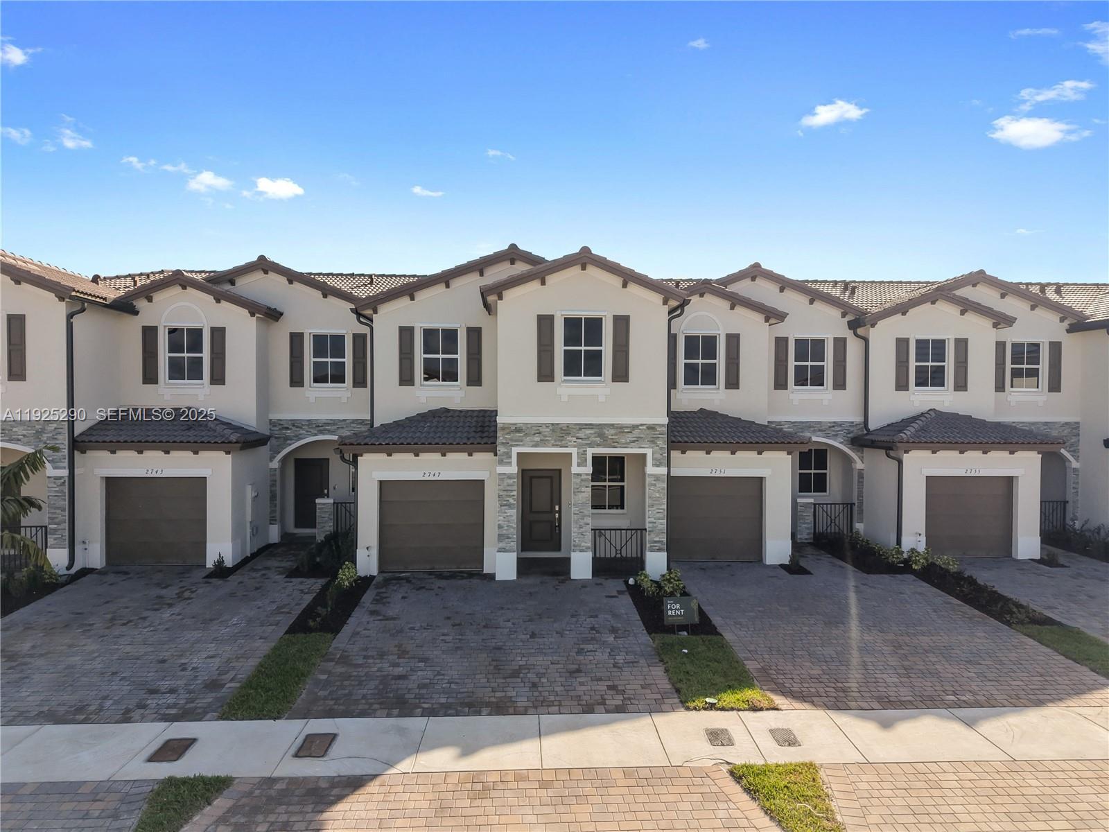 Brand-new two-story townhome for rent offering 1,828 sq ft of living space with 4 bedrooms, 2 full bathrooms and 1 half bath. Never occupied and ready for first tenants. The first floor features a separate living room and dining room, providing defined spaces for everyday use or entertaining. The open kitchen connects to the family room and opens to a covered patio with a lake-view backyard, offering privacy and outdoor space. Upstairs includes a spacious primary bedroom with in-suite bathroom and three additional bedrooms, all with ample closet space. Full-size washer and dryer area, one-car garage, and additional driveway parking. New construction finishes throughout. Located in a quiet, well-planned community with access to amenities including clubhouse, fitness center, swimming pool, tennis courts, BBQ areas, golf course and parks. Minutes to Publix, Homestead High, and Fl Turnpike. Just a short drive to the FL Keys! Move-in ready with immediate availability.