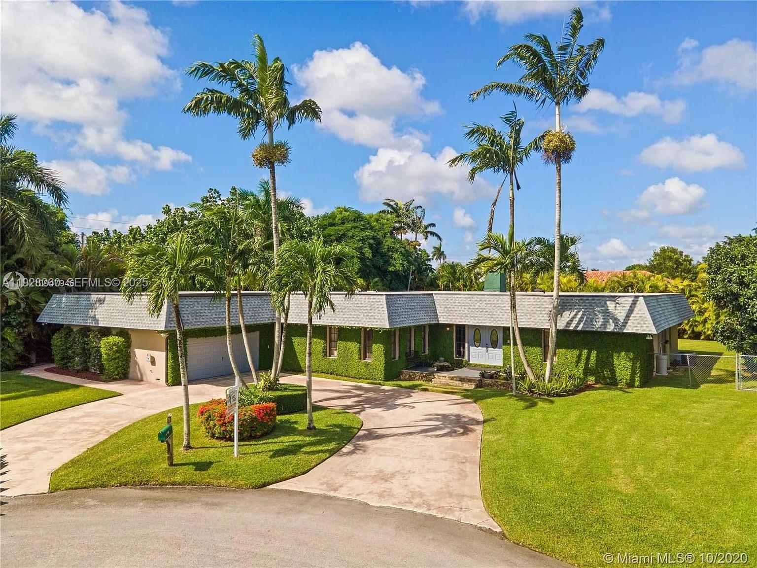 Tucked away at the end of a quiet cul-de-sac, this spacious 5BR/3.5BA pool home sits on nearly half an acre with no HOA and over 3,500 sq ft under air. The flexible tri-split floor plan offers an oversized primary suite with a spa-like bath and two walk-in closets, a junior suite for guests, plus additional bedrooms that give everyone their own space. At the heart of the home is a true chef’s kitchen with a huge pantry, coffee bar, ice maker, reverse osmosis system, and cooking island, opening directly to the pool and patio for easy entertaining. A double-sided fireplace anchors the formal and family living areas, complemented by custom cabinets and built-ins throughout, a dedicated office/den, and a 2-car garage with A/C storage. Outside, enjoy a screened pool with detached spa, summer kitchen with beverage fridge and sink, pavered driveway, and generous parking with room for boat/RV (buyer to verify). A rare combination of space, privacy, and comfort in Homestead—ready for your next chapter.