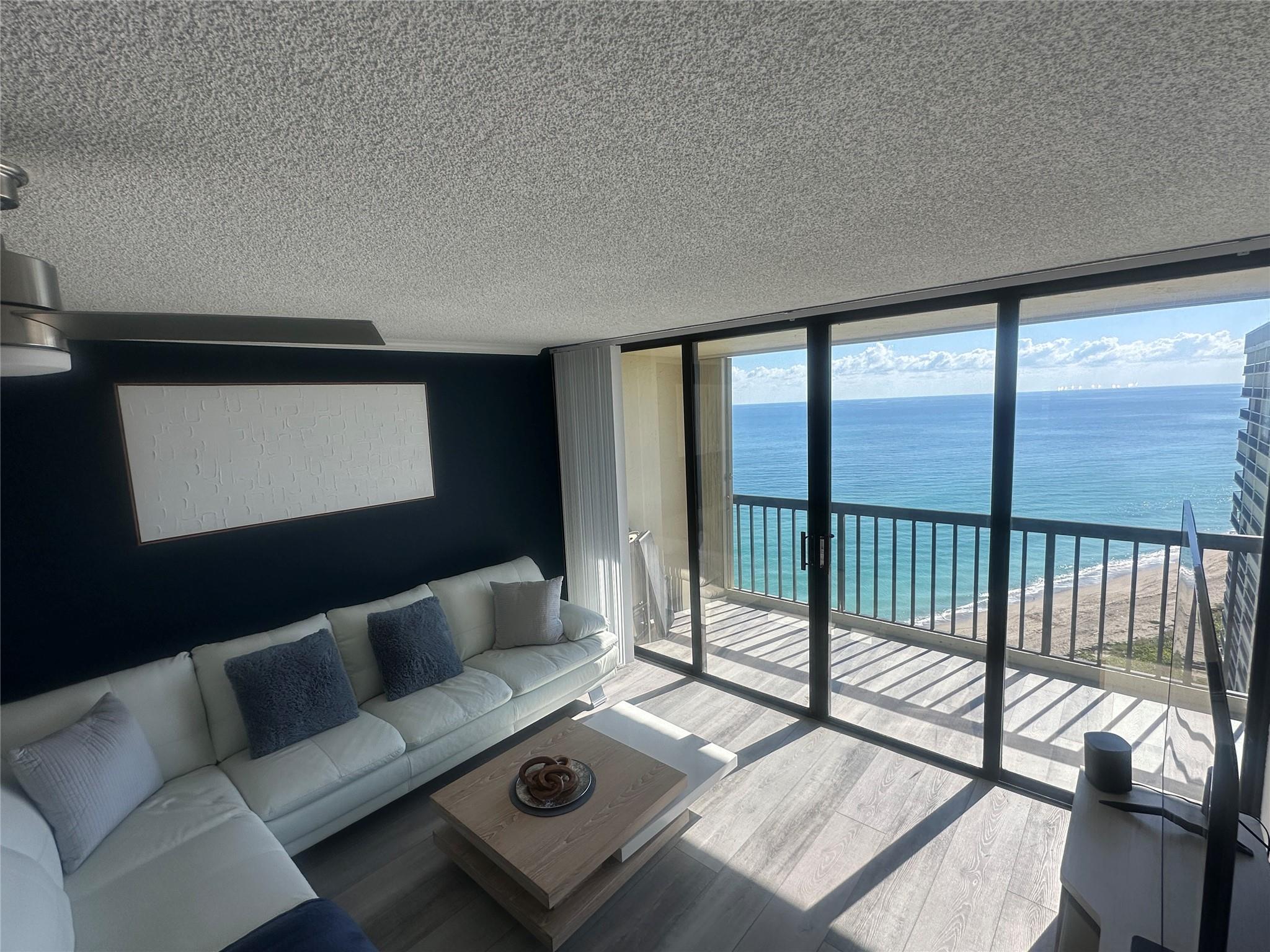 Be wowed in this newly remodeled oceanfront condo, with unobstructed breathtaking views from the minute you walk in the door. with over $150K in the remodel. New wood kitchen cabinets with quartz waterfall countertop, wine and coffee bar area to enjoy your morning coffee. New stainless steel appliances, and led lighting in kitchen,New installed luxury vinyl floors , custom closets, new water heater,