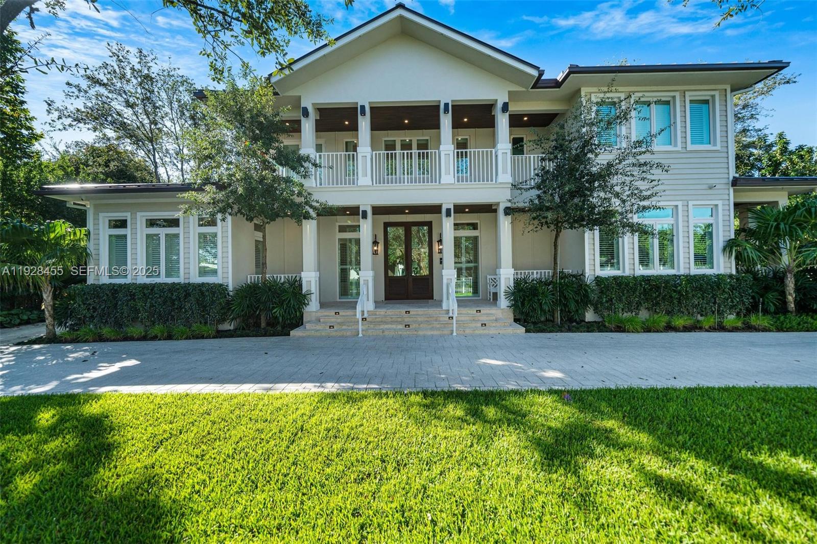 This brand-new Modern Key West–style estate blends coastal elegance with contemporary luxury in the heart of Pinecrest. Privately gated and surrounded by lush tropical landscaping, this custom-built residence offers nearly 9,000 SF of refined living with exceptional craftsmanship, thoughtful design, and cutting-edge technology throughout. The home features 5 bedrooms including a fully autonomous 1-bedroom guest apartment with full kitchen and private entrance. Additional highlights include 6.5 bathrooms, a dedicated office, custom gym, and a residential elevator.A grand double-height foyer opens to bright, airy living spaces with designer lighting, custom built-ins, and top-of-the-line fixtures and appliances. All bedrooms feature private balconies, while the main master suite offers direct pool access and a boutique-style dressing room. The living room includes a sleek gas fireplace ignited with the press of a button.The resort-style backyard is perfect for entertaining, complete with a sparkling pool, summer kitchen, and covered terraces surrounded by lush greenery. Fully integrated with state-of-the-art smart-home automation, impact windows and doors, and a 2-car garage, this estate embodies modern design, coastal sophistication, and elevated living in one of Pinecrest’s most sought-after neighborhoods.