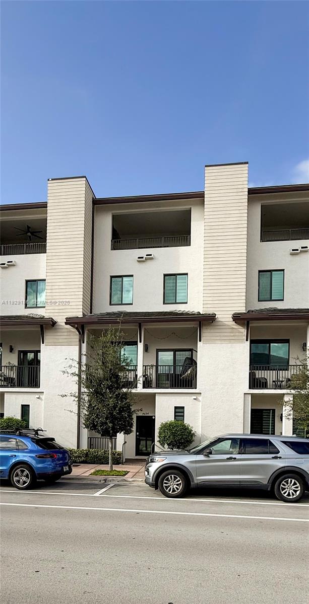 Beautiful 4 story smart TH with private elevator providing access to each floor, just 2 blocks from the clubhouse with unobstructed views, open kitchen concept with stainless steel appliances & quartz countertops, 2 car garage, impact windows, zebra-style blinds, living room has electric blind. 1st, 2nd & 4th level ceramic floor, 3rd level carpet floor, 3 bedrooms, 3 full baths, 2 half baths, 2 A/C, Ring alarm system with sensors on doors & windows, and indoor cameras. The 4th floor offers a versatile space originally designed as a family room, with a private balcony and area for a table, grill, refrigerator, and sink. This space, with excellent lighting and privacy, also functions ideally as a workspace or small studio for those who create content, record videos, or take photos from home. An added value that provides flexibility and unique possibilities to suit your lifestyle. Stunning clubhouse with fitness center, indoor basketball court & running track, pool with sun deck, cabanas and a splash area for kids and more. Near restaurants, shops, parks, A+ rated schools.