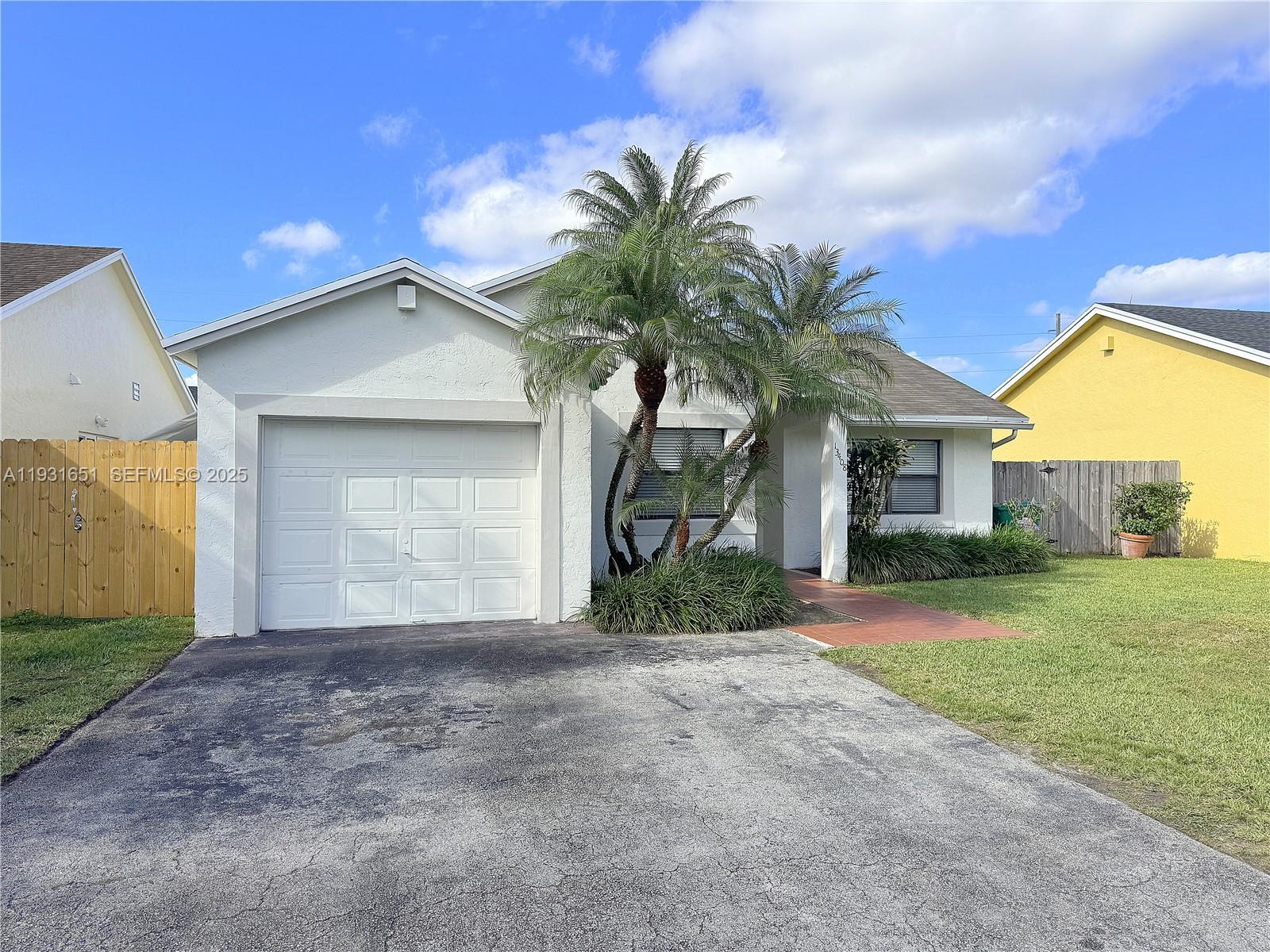 READY TO MOVE IN! Single-family home with 1-car garage! Features tile flooring throughout the home. Spacious living area with French doors leading to the back patio. Primary bedroom with bathroom en-suite, walk-in closet,  and access to the back patio. Near the FL Turnpike.
