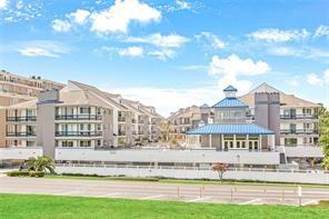 The Association offers, Automatic Gated community, Individual codes &  Visitor covered parking available.  mail area,  1mile from shopping and 3 blocks from restaurants. Across the street is a bike path, lake and  walking path. Unit is freshly painted, has new washer and dryer, dishwasher,& microwave. New double glass door in unit, Renovated kitchen Walk in closets ,under counter lighting & quarterly pest control treatment. Elevator accessible, reserved parking space # 59, & storage locker #59 by parking.24 hour camera surveillance. Designated package delivery with code. Ready to move in.