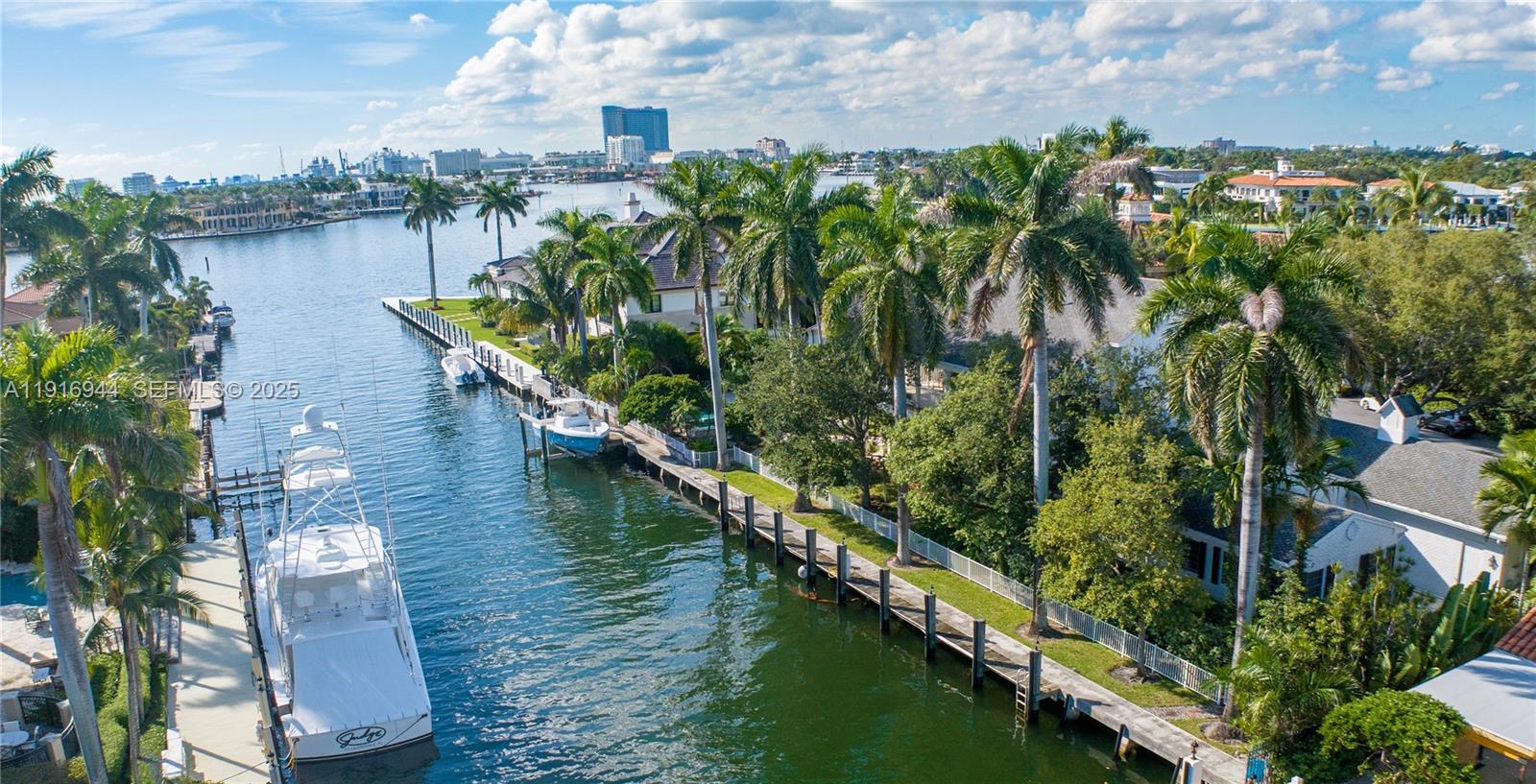 A truly rare Las Olas waterfront offering, just one property from the point and distinguished by an extraordinary 235 feet of straight-line Intracoastal frontage—an unparalleled setting for a premier yachting lifestyle. Set on an expansive 18,744-square-foot lot, the estate offers effortless ocean access, a private boat lift, and sweeping water views. The stately Colonial residence features nearly 5,000 square feet under A/C with four generously scaled ensuite bedrooms, 5.1 baths, and a three-car garage, enhanced by a major two-story addition completed in 1992. Outdoors, a resort-style pool and spa are framed by mature, manicured landscaping on one of Las Olas’ most prestigious streets.